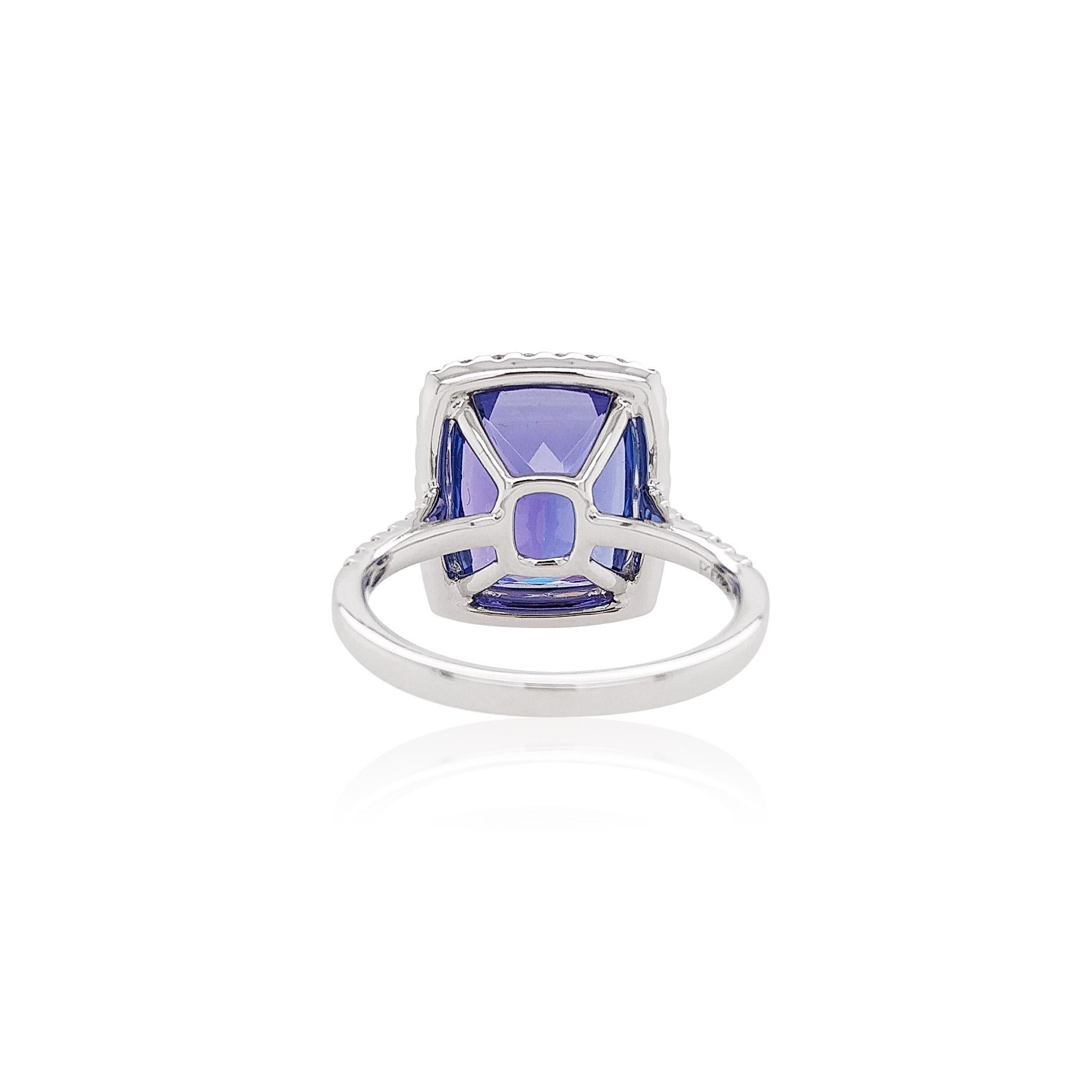 This graceful ring features a lustrous Tanzanite set amongst sparkling White Diamonds. The platinum setting enriches the cool hues of the Tanzanite and the sparkle of the White Diamonds. This ring holds romantic connotations and would make a
