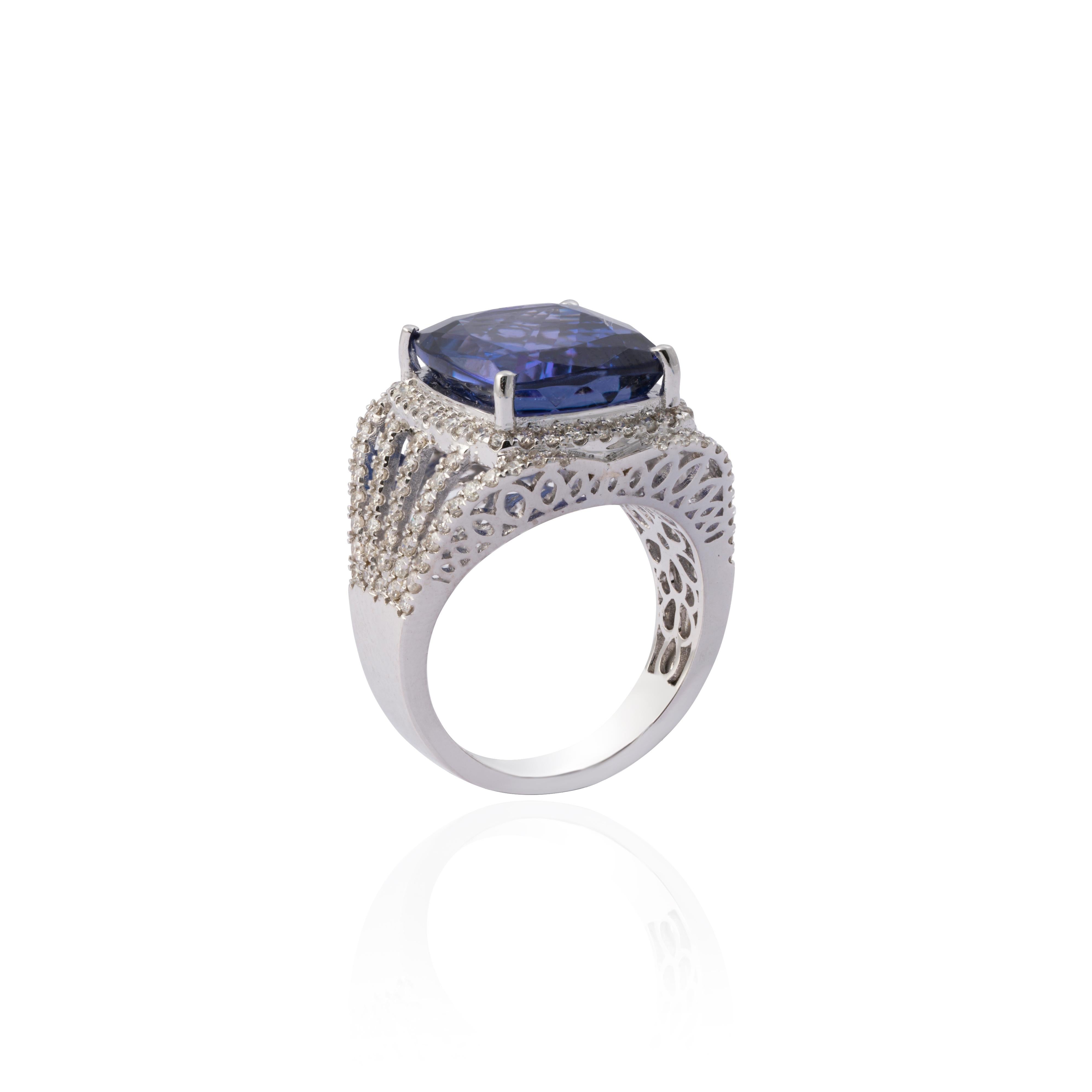 This is a beautiful natural tanzanite cushion shape tanzanite ring with 14k gold and diamonds.

tanzanite is very good colour and excellent quality and diamonds are of vsi purity and G colour.  

tanzanite : 11.14 cts
diamond : 1.09 cts
gold : 7.69