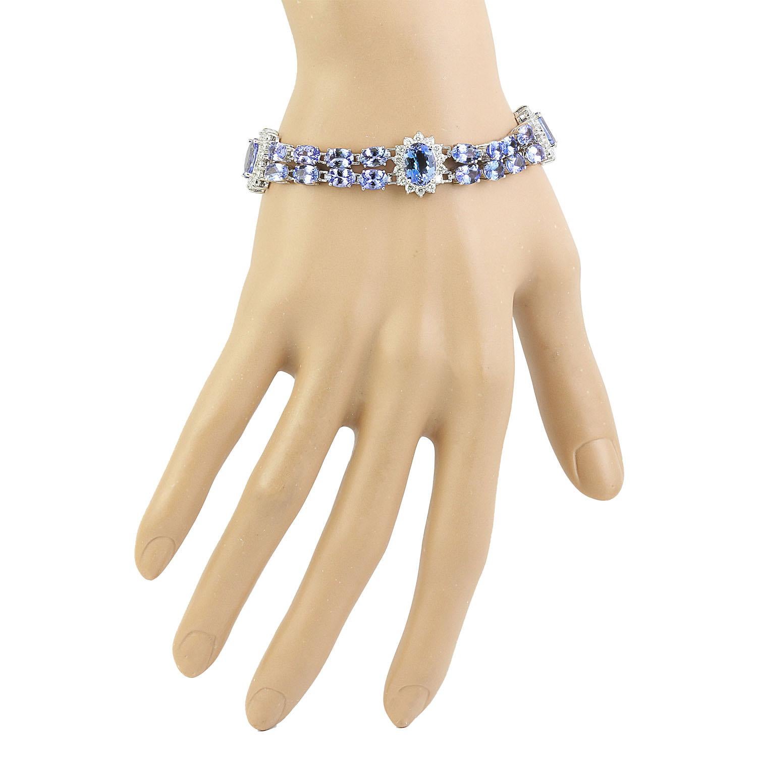 25.20 Carat Natural Tanzanite 14 Karat Solid White Gold Diamond Bracelet
Stamped: 14K
Total Bracelet Weight: 17.8 Grams 
Bracelet Length: 6.5 Inches
Center Tanzanite Weight: 6.20 Carat (9.00x7.00 Millimeter)
Side Tanzanite Weight: 17.50 Carat