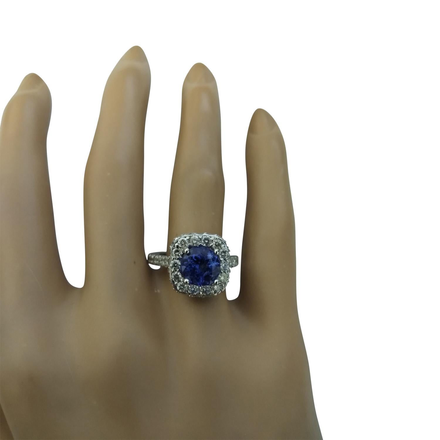 2.87 Carat Natural Tanzanite 14 Karat Solid White Gold Diamond Ring
Stamped: 14K 
Total Ring Weight: 5.7 Grams 
Tanzanite Weight 1.87 Carat (7.00x7.00 Millimeters)
Diamond Weight: 1.00 carat (F-G Color, VS2-SI1 Clarity )
Face Measures: 12.30x12.30