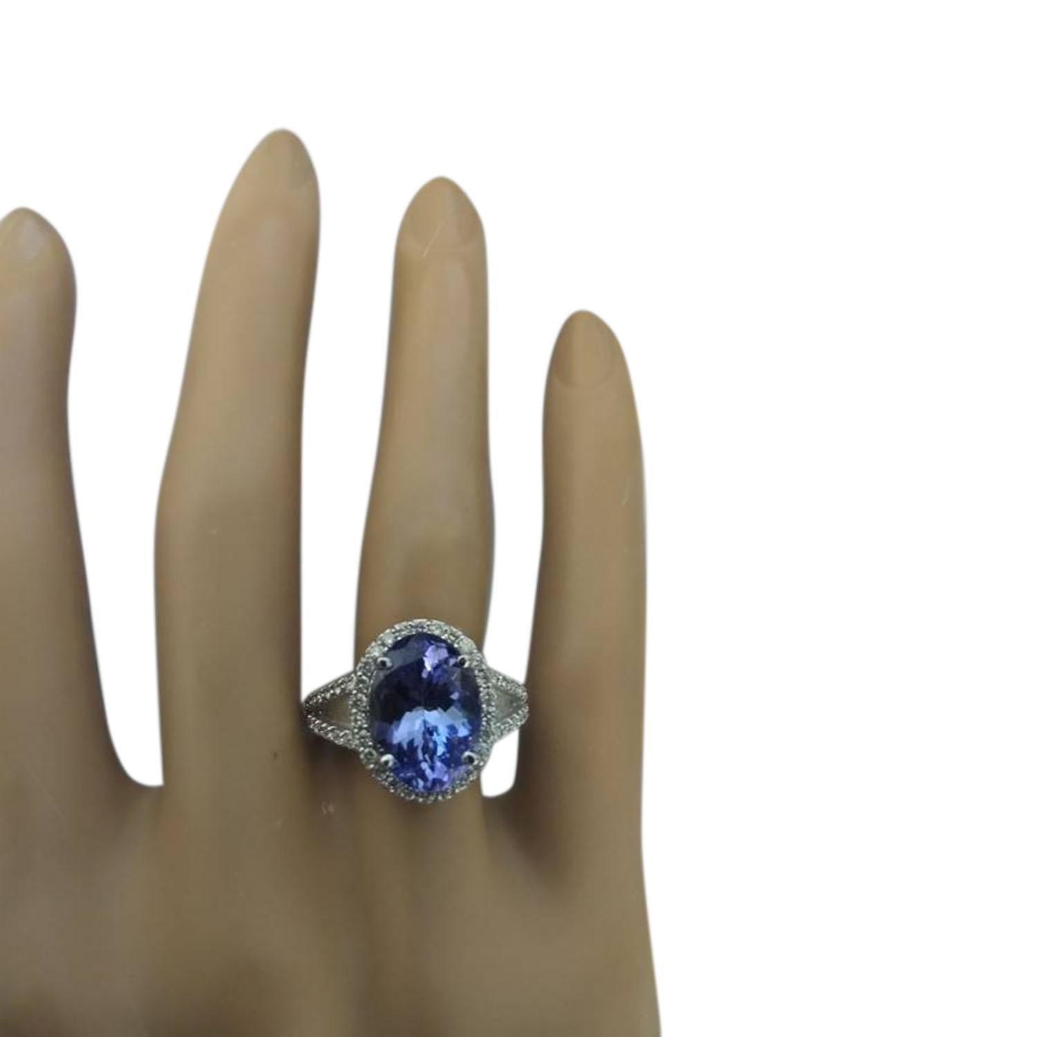 6.10 Carat Natural Tanzanite 14 Karat Solid White Gold Diamond Ring
Stamped: 14K 
Ring Size 7
Total Ring Weight: 6.1 Grams 
Tanzanite Weight 5.50 Carat (11.00x9.00 Millimeters)
Diamond Weight: 0.60 Carat (F-G Color, VS2-SI1 Clarity )
Face Measures: