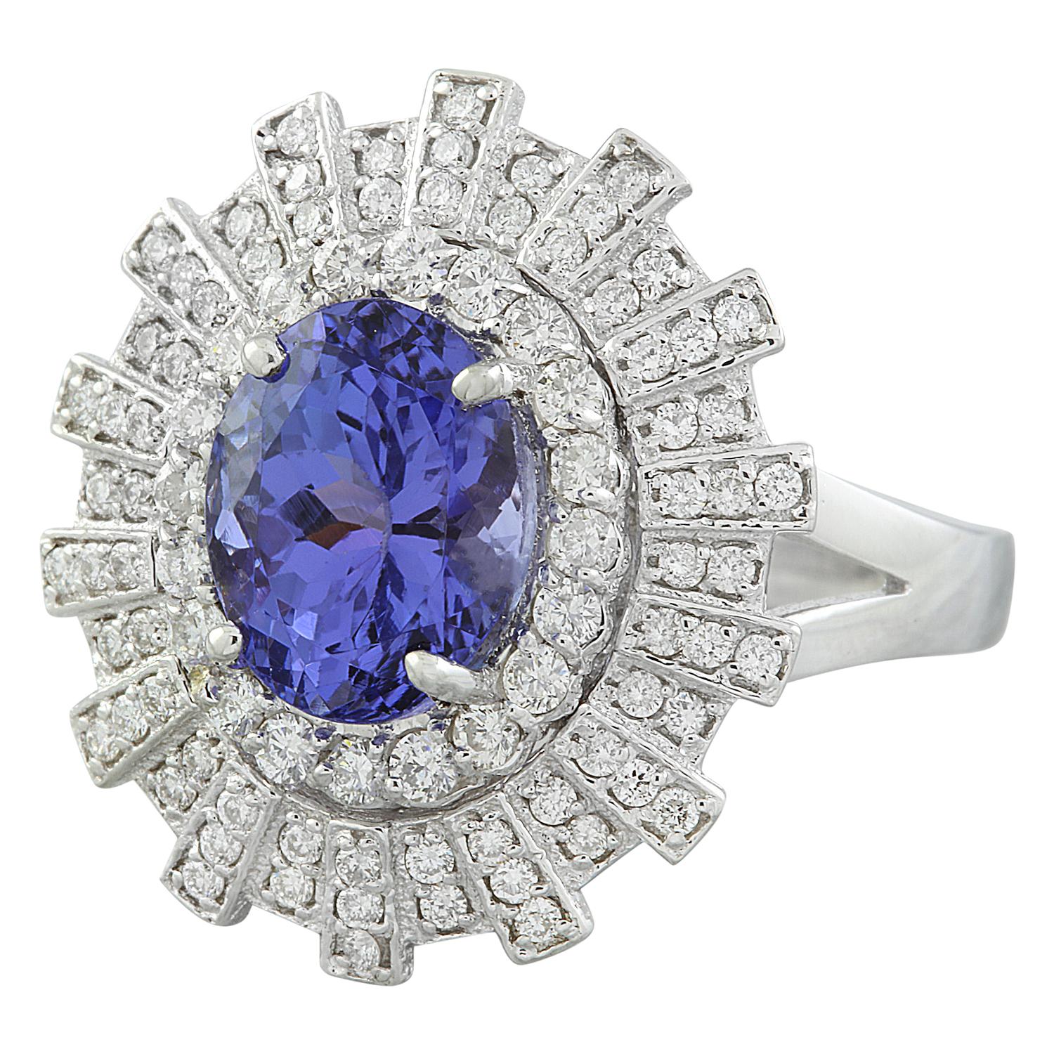 4.49 Carat Natural Tanzanite 14 Karat Solid White Gold Diamond Ring
Stamped: 14K 
Total Ring Weight: 7.4 Grams 
Tanzanite Weight 3.69 Carat (10.00x8.00 Millimeters)
Diamond Weight: 0.80 carat (F-G Color, VS2-SI1 Clarity )
Quantity: 90
Face Measures: