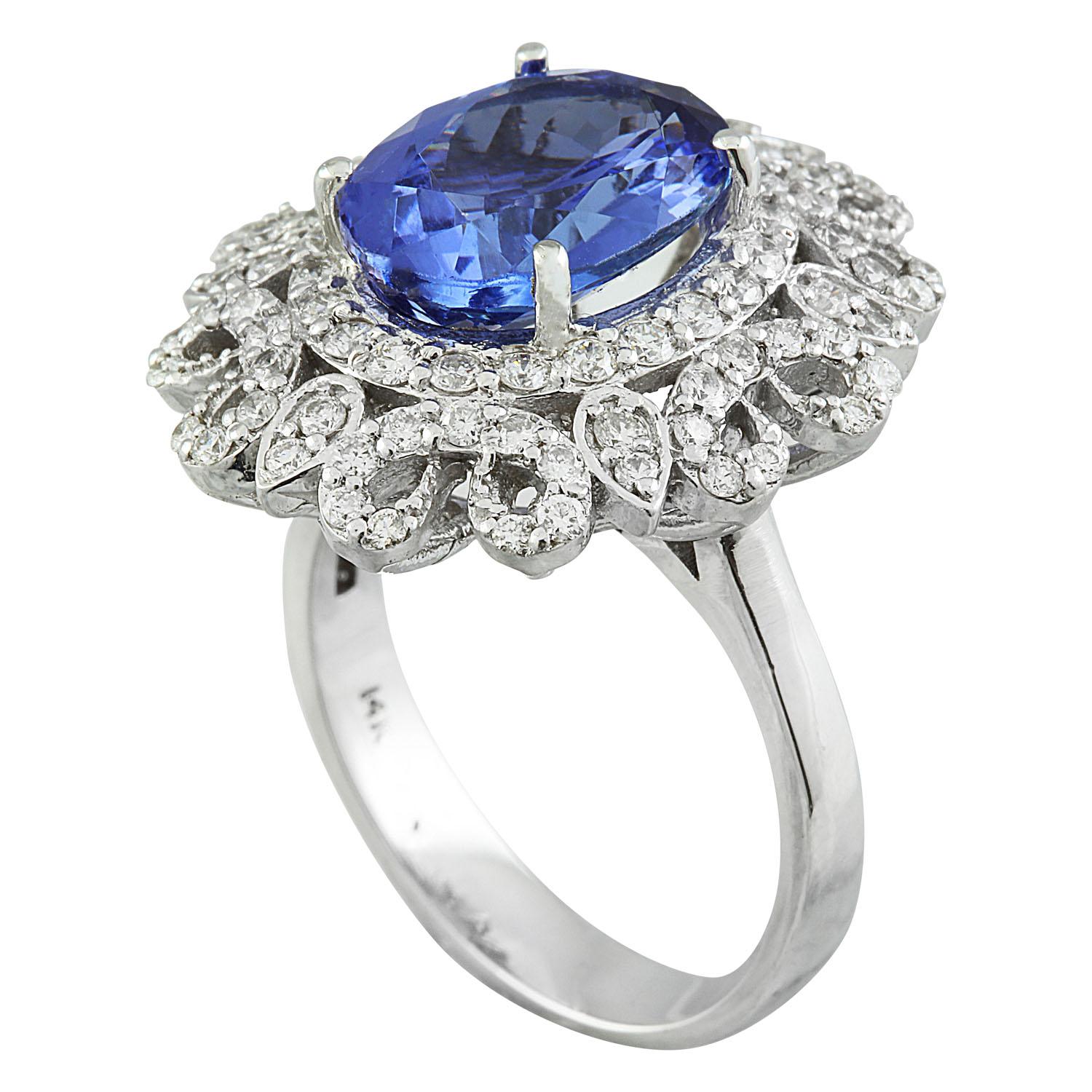 7.00 Carat Natural Tanzanite 14 Karat Solid White Gold Diamond Ring
Stamped: 14K 
Total Ring Weight: 7.1 Grams 
Tanzanite Weight 6.00 Carat (12.00x10.00 Millimeters)
Diamond Weight: 1.00 carat (F-G Color, VS2-SI1 Clarity )
Face Measures: 22.55x19.95