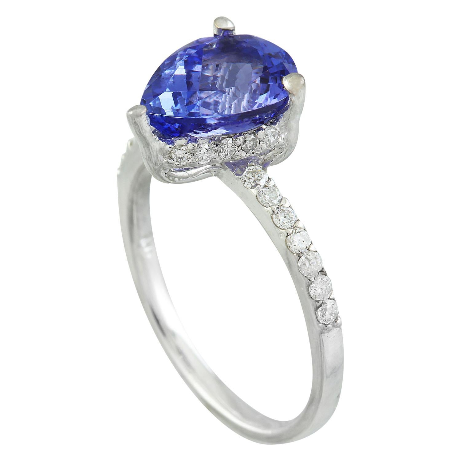 2.95 Carat Natural Tanzanite 14 Karat Solid White Gold Diamond Ring
Stamped: 14K 
Total Ring Weight: 3.2 Grams 
Tanzanite Weight 2.65 Carat (10.00x8.00 Millimeters)
Diamond Weight: 0.30 carat (F-G Color, VS2-SI1 Clarity)
Face Measures: 10.20x7.80