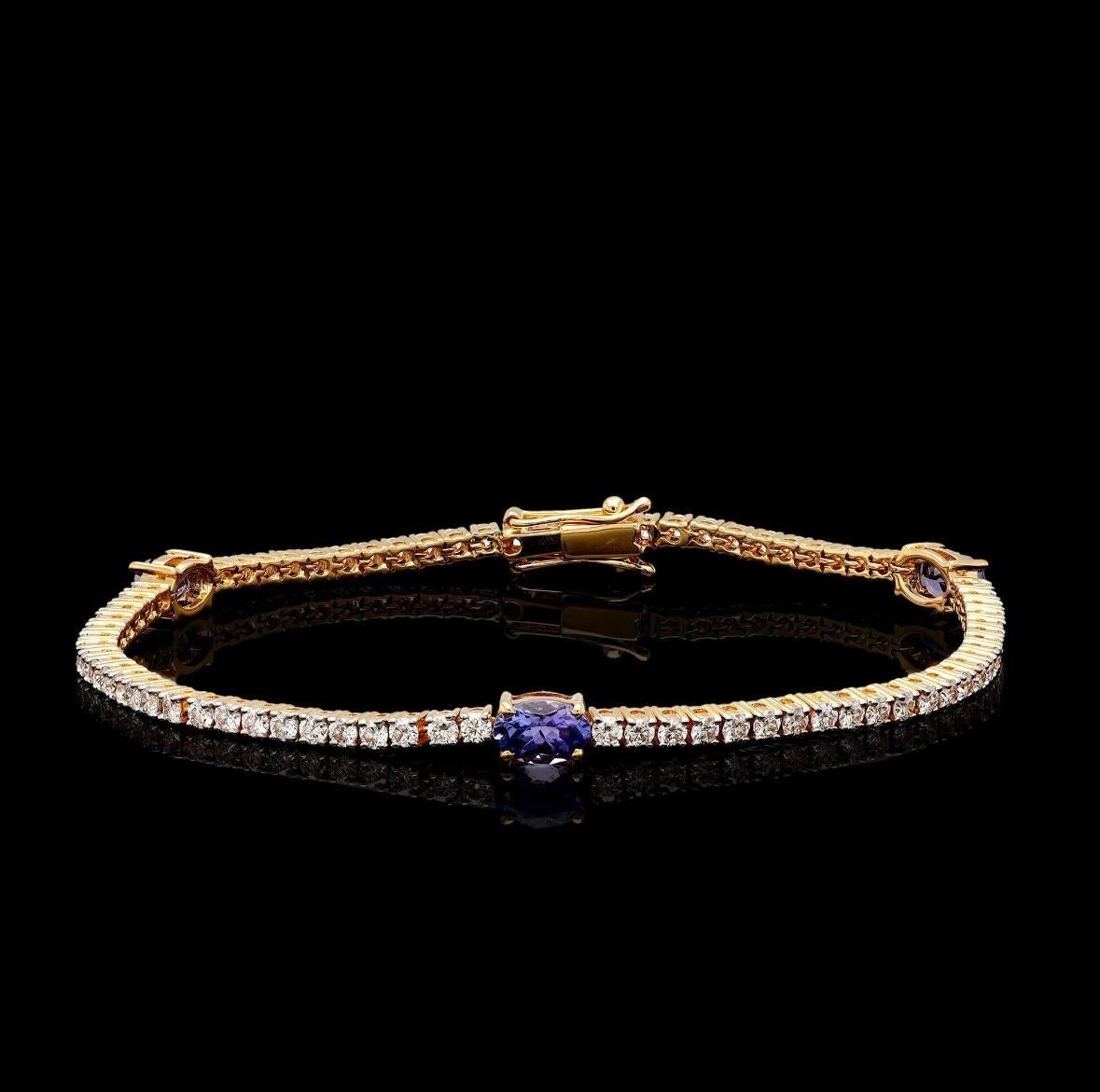 Donna Bracciale tennis con tanzanite naturale e diamanti in oro 18 carati in vendita