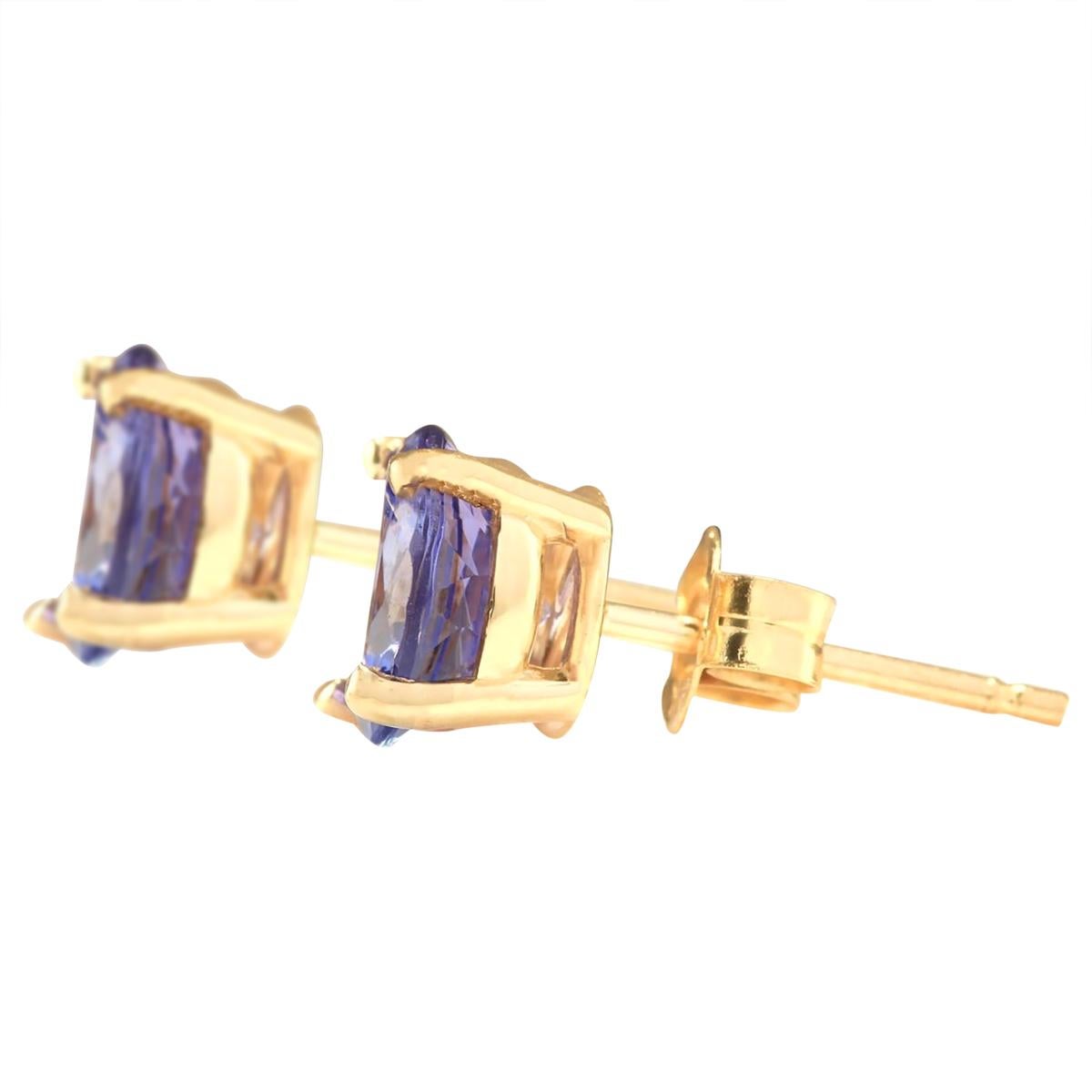 Introducing our stunning 2.30 Carat Natural Tanzanite Earrings, crafted with finesse in 14K Yellow Gold. Each earring bears the authentic 14K stamp and weighs a mere 1.2 grams, ensuring comfort and elegance. The captivating tanzanite gemstones,