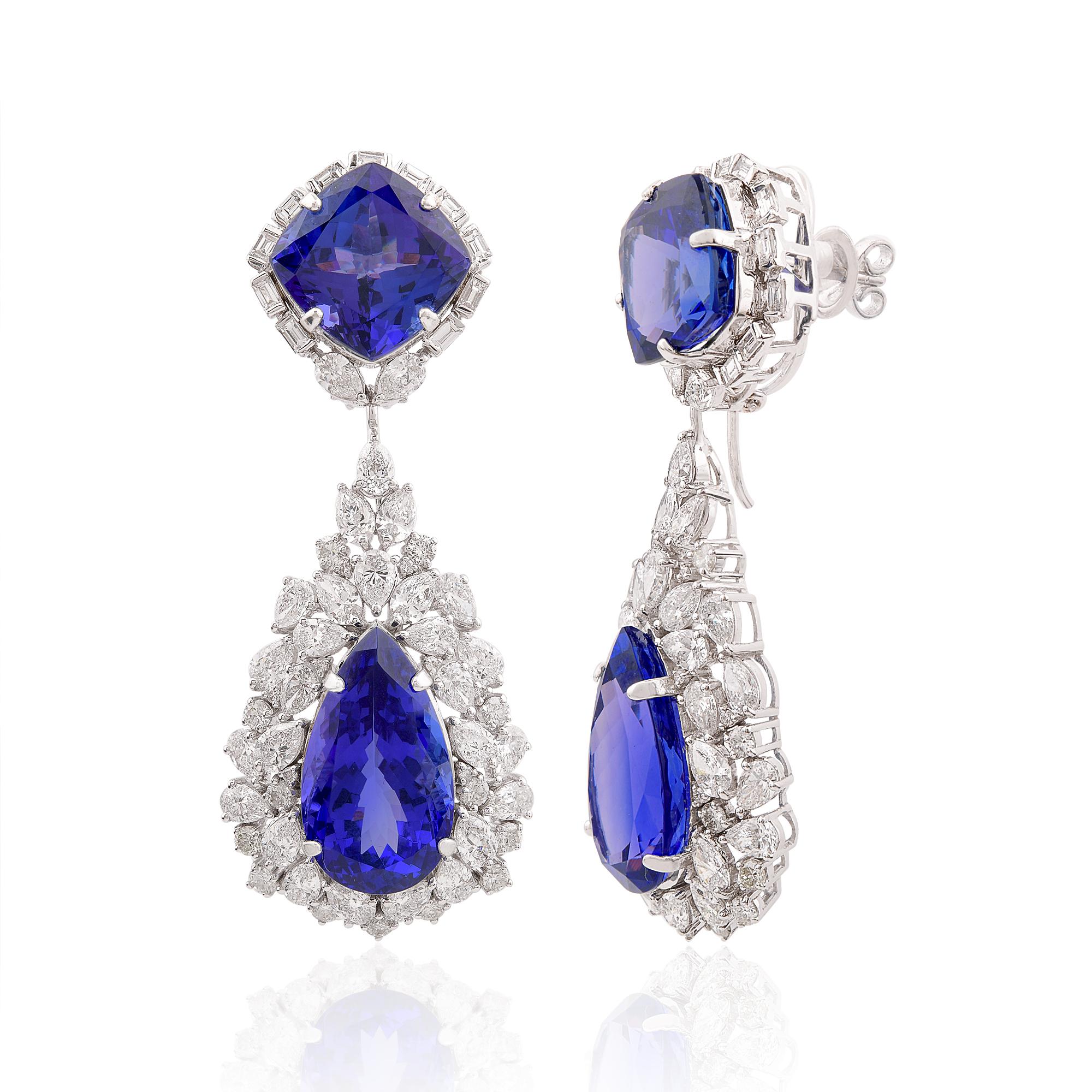 Cast from 14-karat gold, these exquisite earrings are handset with 61.61 carats tanzanite & 11.40 carats of sparkling diamonds. Tanzanite is a December birthstone and is believed to offer emotional healing and enhanced focus. A wonderful gift for