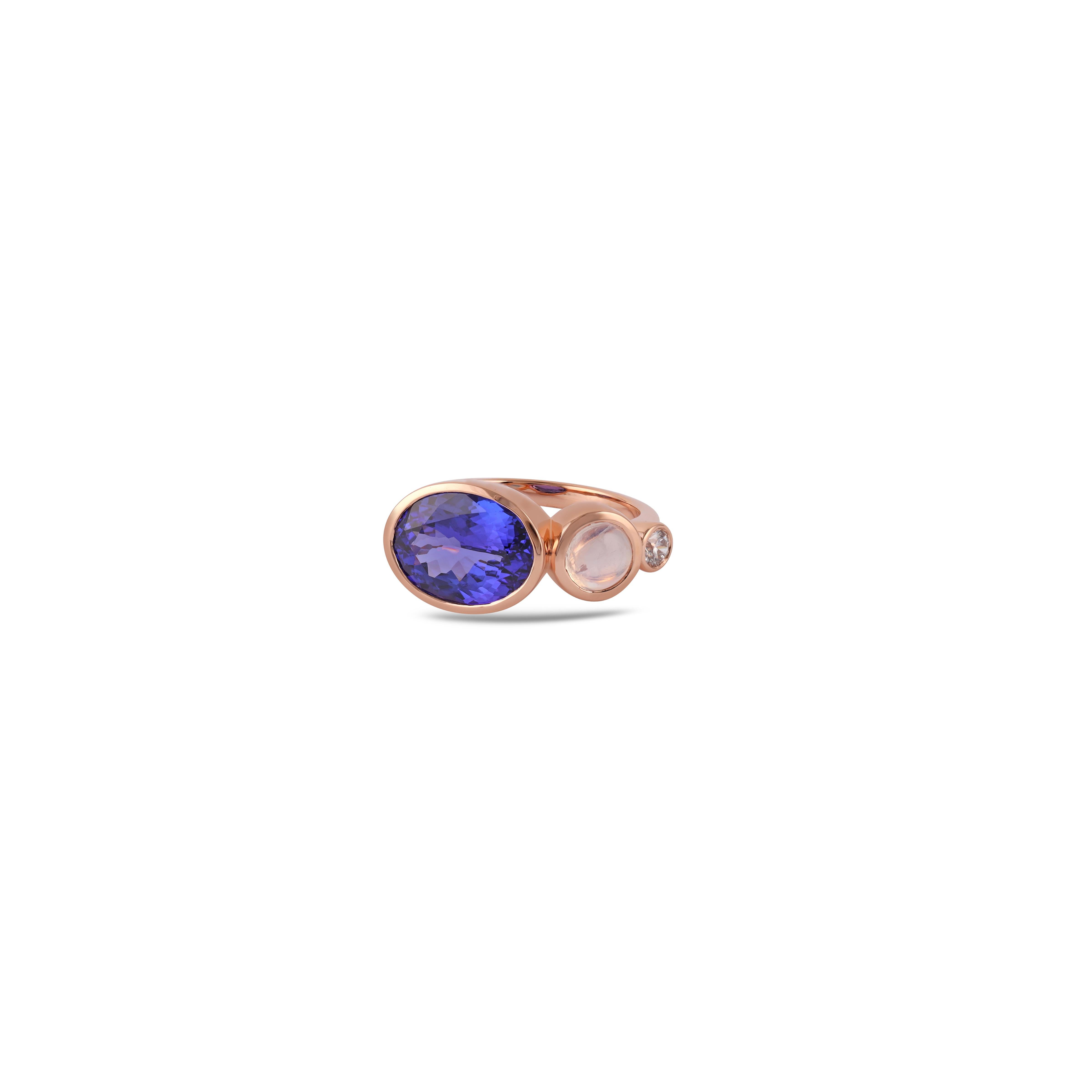 This is an elegant Tanzanite  & Multi Stones ring studded in 18k Rose gold features a fine quality of Oval-shaped Tanzanite 4.04 carats with 1 Diamond 0.14 carats, Multi Stone  0.98 Carat this entire ring is made in 18k Rose gold, it is a classic