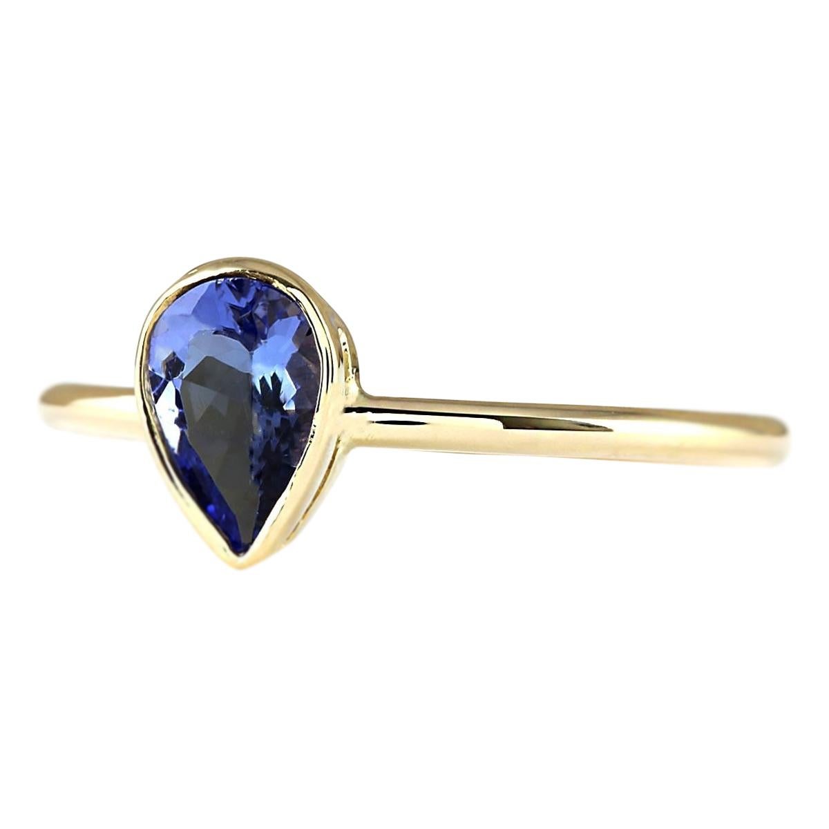 Introducing our exquisite 14 Karat Yellow Gold Ring adorned with a stunning 0.50 Carat Natural Tanzanite gemstone. Stamped for authenticity, this ring weighs a mere 1.2 grams, ensuring comfort and wearability. The Tanzanite gemstone, boasting a