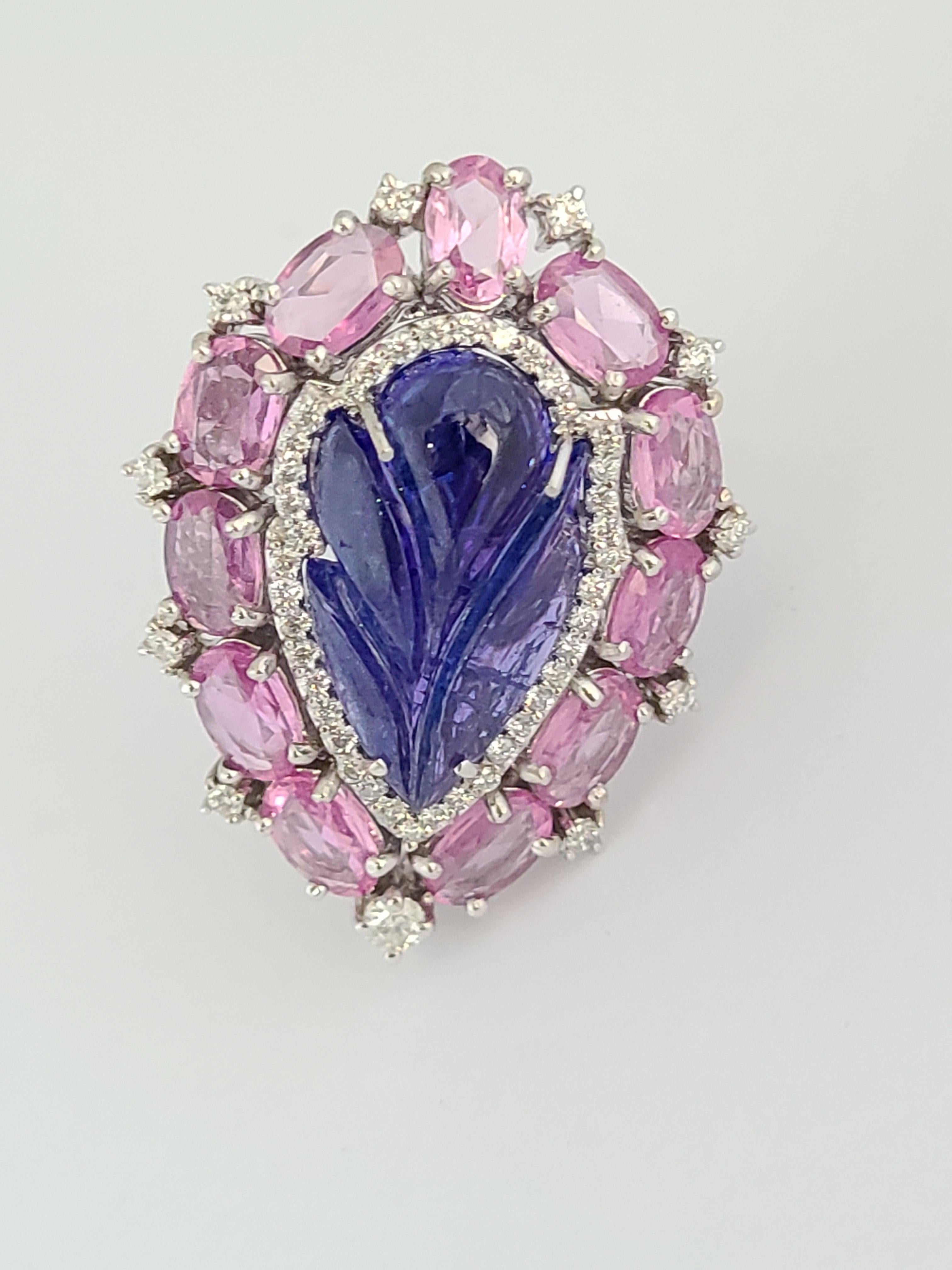 Modern Natural Tanzanite Ring with Pink Sapphires Set in 18 Karat Gold with Diamonds