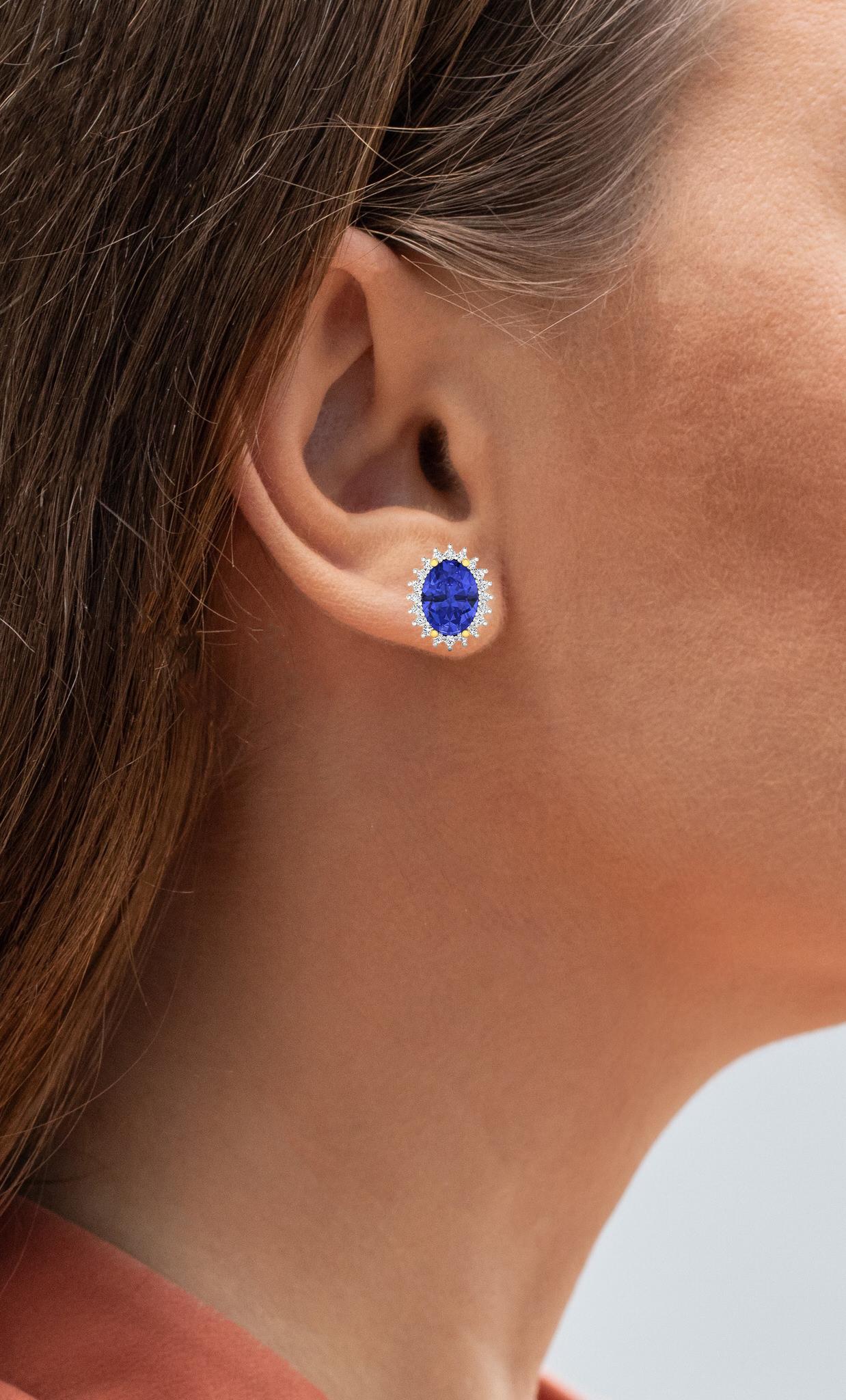 It comes with the Gemological Appraisal by GIA GG/AJP
All Gemstones are Natural
2 Oval Tanzanite = 2.30 Carats
40 Diamonds = 0.30 Carats
Metal: 14K Yellow Gold
Dimensions: 11 x 9 mm