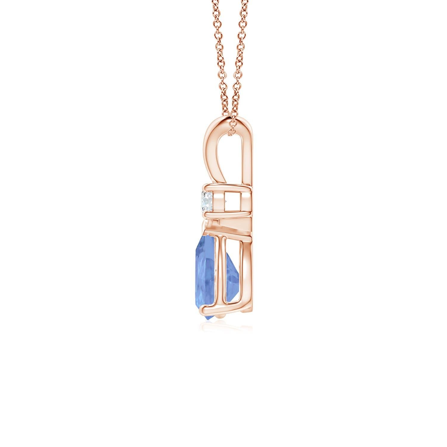 This classic solitaire pendant features a pear-shaped tanzanite secured in a prong setting. A glimmering round diamond sits atop the bluish-violet gemstone adding to the design's sparkle. Simple yet alluring, this tanzanite pendant in 14k rose gold