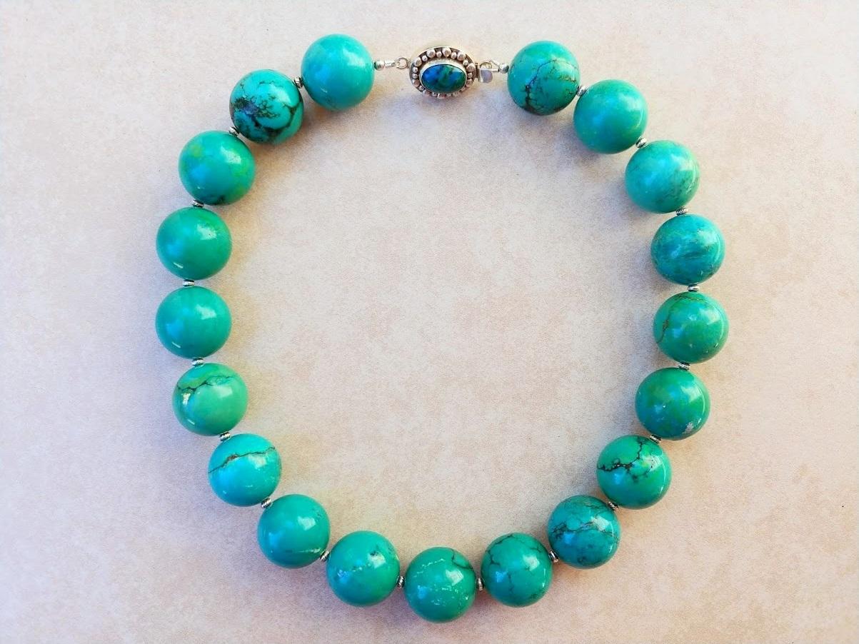 Exceptional necklace of natural Tibetan Turquoise beads of very rare large size.
The length of the necklace is 19 inches (48 cm). The rare size of the huge smooth round beads is 22 mm.
The color of the beads is a mixture of sea-green and aquamarine