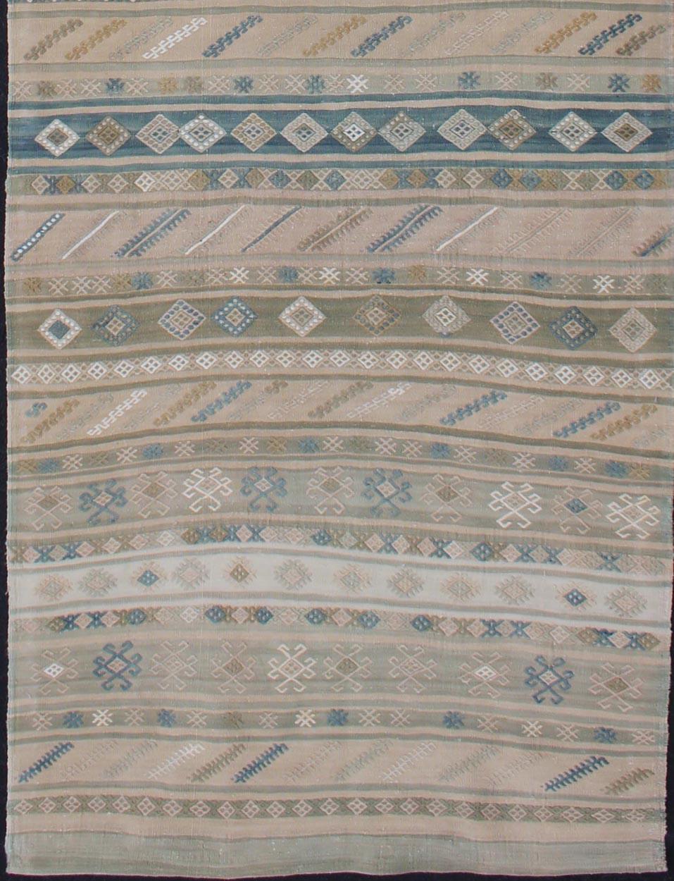 Stripe design Kilim runner with geometric motifs, rug en-176922, country of origin / type: Turkey / Kilim, circa 1950

This flat-woven Kilim runner from Turkey features an exciting composition consisting of stripes rendered in natural tones. The