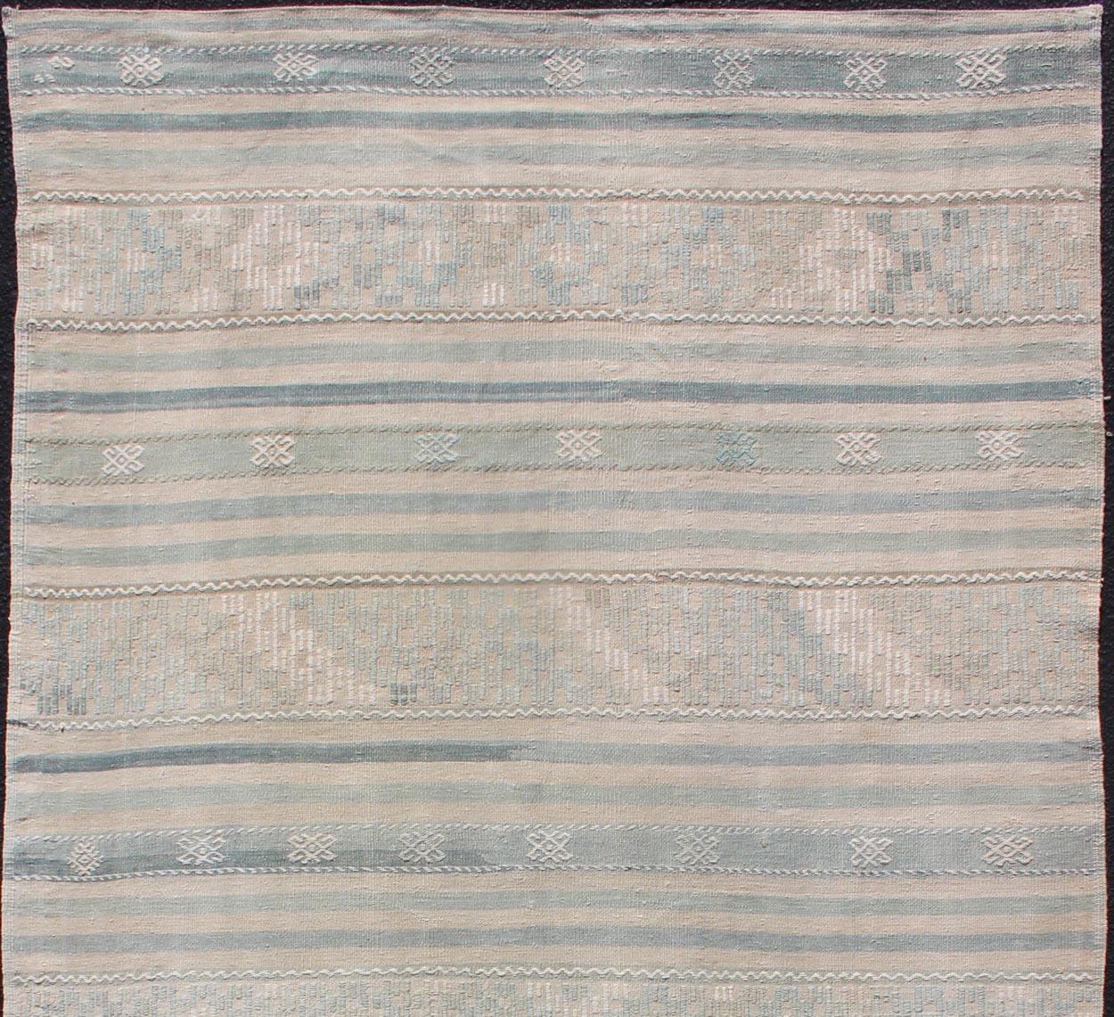 Stripe design Kilim with geometric motifs, Keivan Woven Arts / rug EN-179486, country of origin / type: Turkey / Kilim, circa 1950

This flat-woven Kilim from Turkey features an exciting composition consisting of stripes rendered in natural tones.