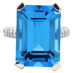 Étincelante bague en or blanc massif 14 carats avec topaze bleue suisse et diamants