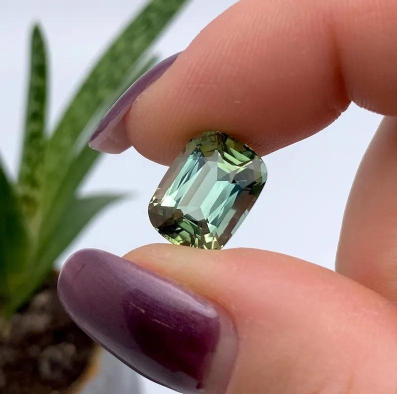Natural Tourmaline gemstone

Certificate GFCO
Gemstone Color: yellowish green
Gemstone Type: Tourmaline
Gemstone size: 13.18x9.85x6.97mm
Cut Grade: Very Good
Clarity/Grade: VVS
Gemstone Shape: cushion cut
Gemstone Creation: Natural
Gemstone