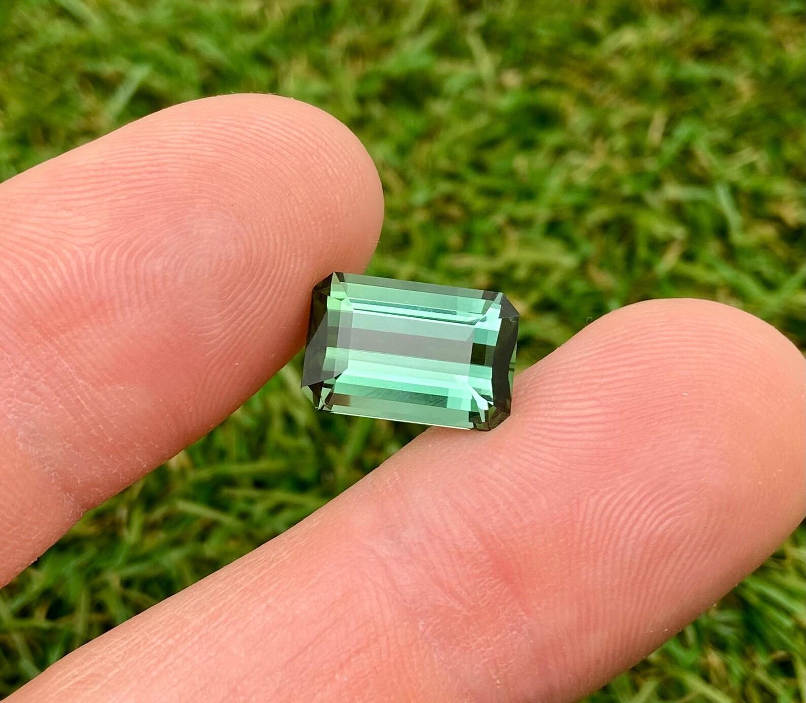 Natural Green Tourmaline Loose Gemstone from Nigeria

Certificate GFCO
Gemstone Color: Green
Gemstone Type: Tourmaline
Gemstone size: 13.73x9.22x6.44 mm
Cut Grade: Excellent
Clarity/Grade: Loop clean
Gemstone Shape: Octagon cut
Gemstone Creation: