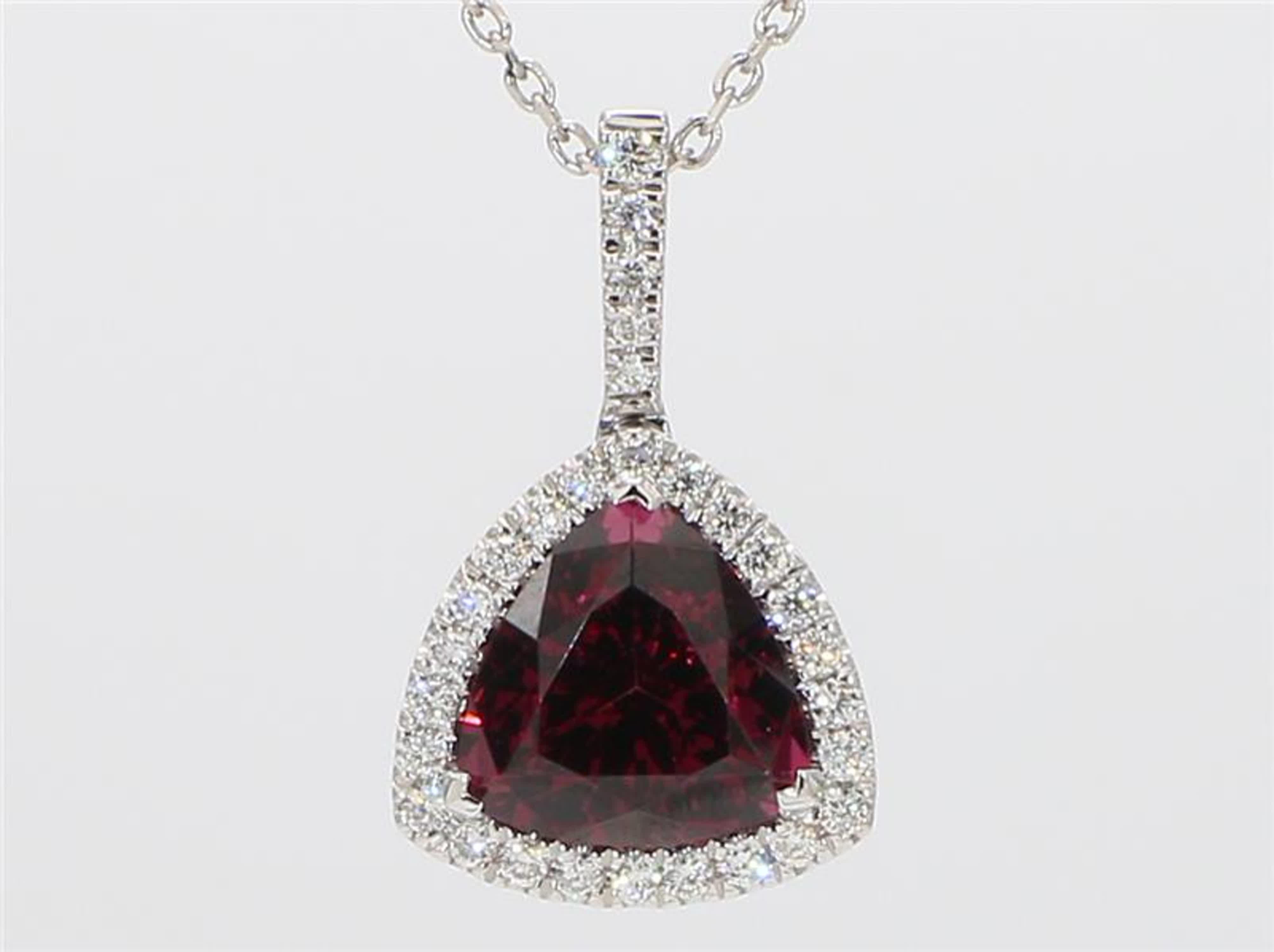 RareGemWorld's intriguing garnet pendant. Mounted in a beautiful 14K White Gold setting with a natural trilliant cut Rhodolite Garnet. The garnet is complimented by a natural round white diamond melee. This pendant is guaranteed to impress and