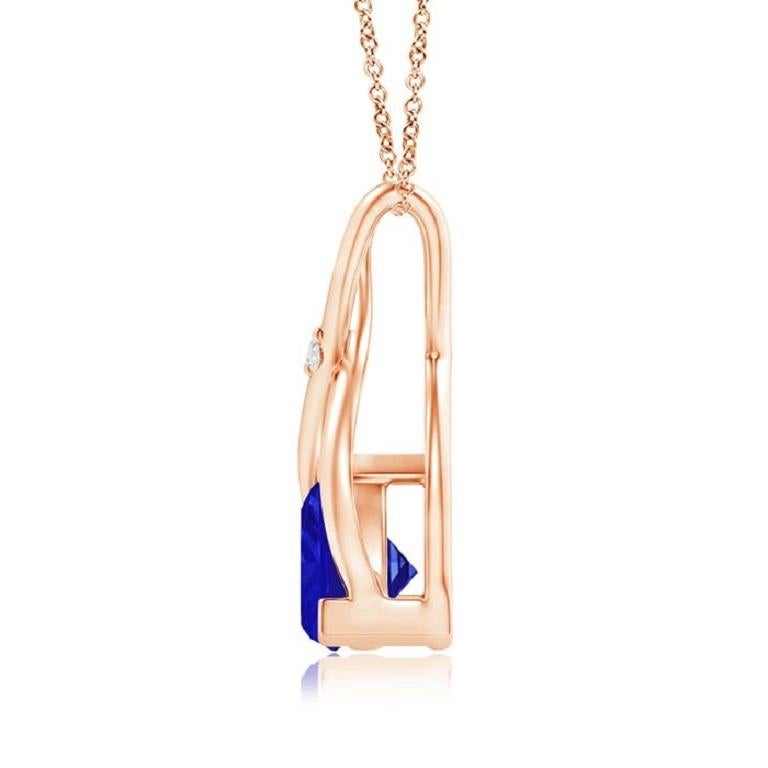 Two lustrous metal strips intersect to form an ornate wishbone bale and are accentuated with a dazzling diamond accent in the center. The wishbone connects to the trillion tanzanite in V prong setting. Designed in 14k rose gold, this bluish-violet