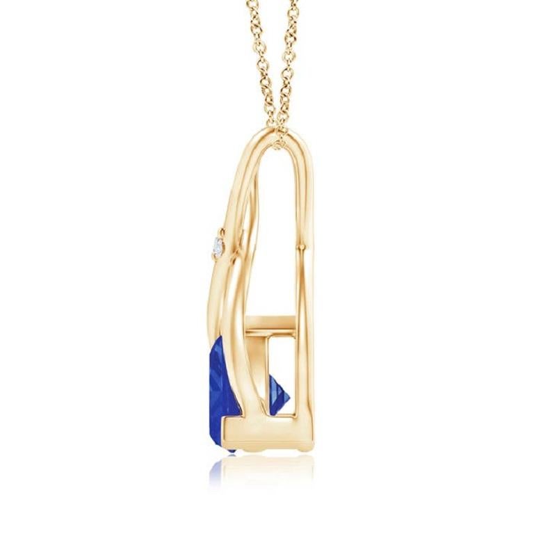 Two lustrous metal strips intersect to form an ornate wishbone bale and are accentuated with a dazzling diamond accent in the center. The wishbone connects to the trillion tanzanite in V prong setting. Designed in 18k yellow gold, this bluish-violet
