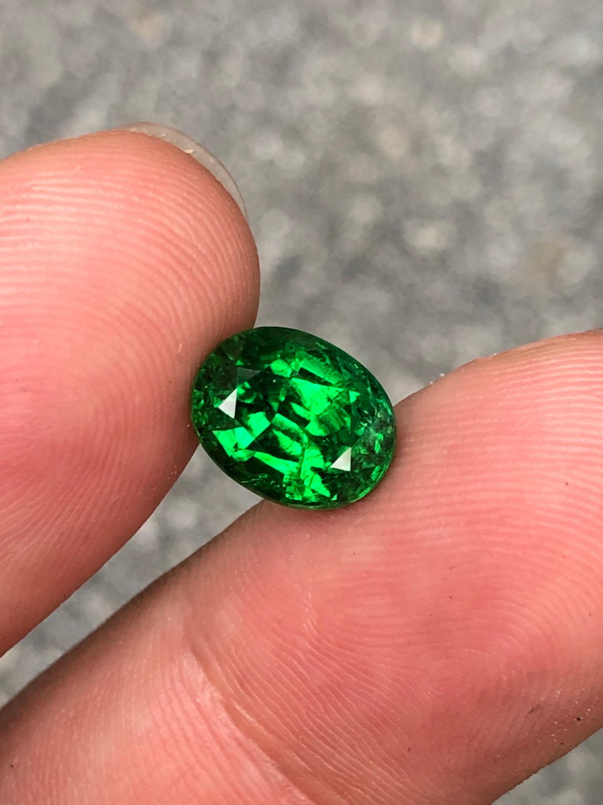 🌿 Introducing our stunning 3.97 ct oval step cut Tsavorite garnet, a captivating gem that embodies the allure of nature's verdant beauty. Experience the brilliance of green hues dancing within its facets, radiating elegance and sophistication.