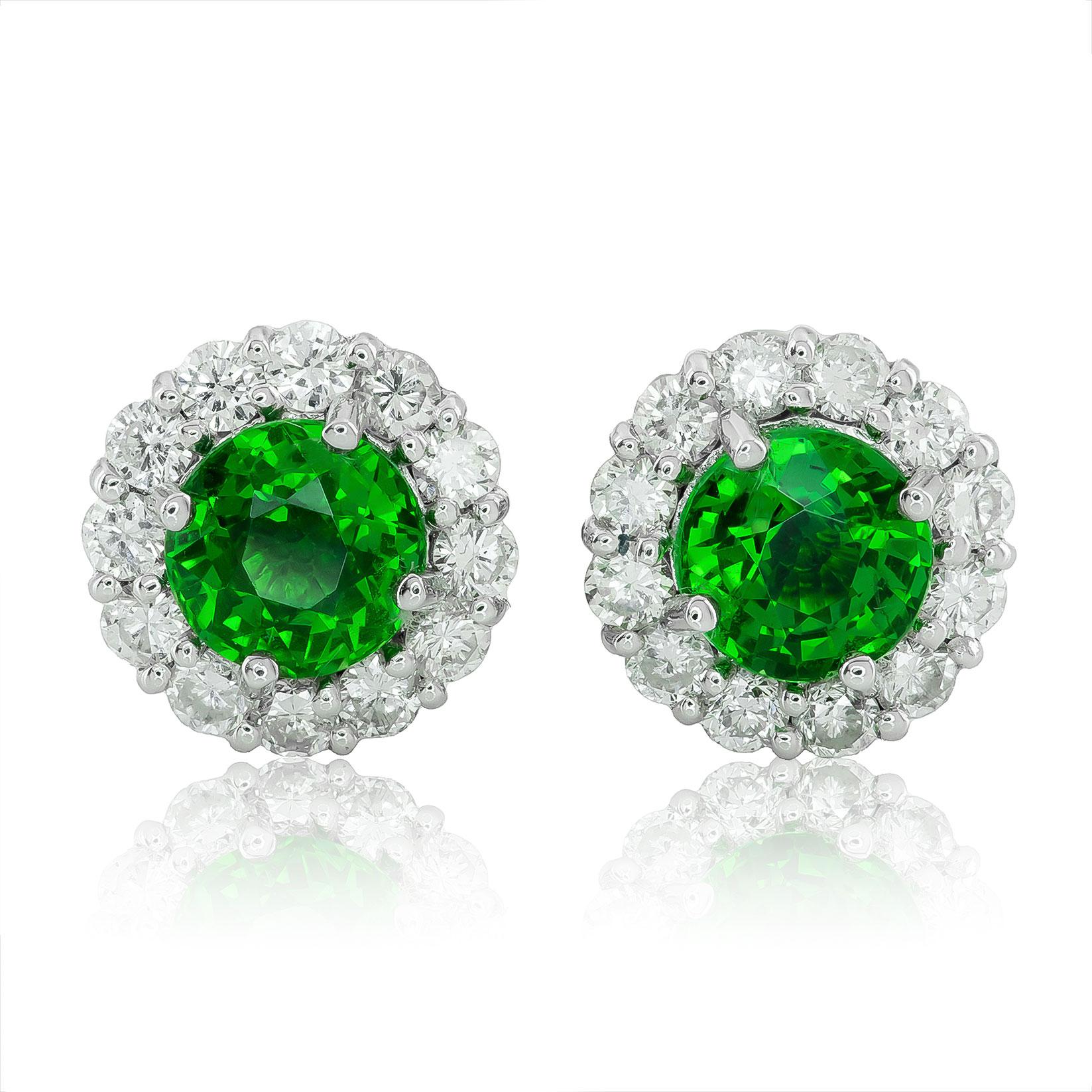 Discover the captivating beauty of these natural tsavorite earrings, featuring a total weight of 1.55 carats, set in sleek 14K white gold. Accented with 0.52 carats of radiant diamonds, these earrings offer a sophisticated blend of vibrant color and