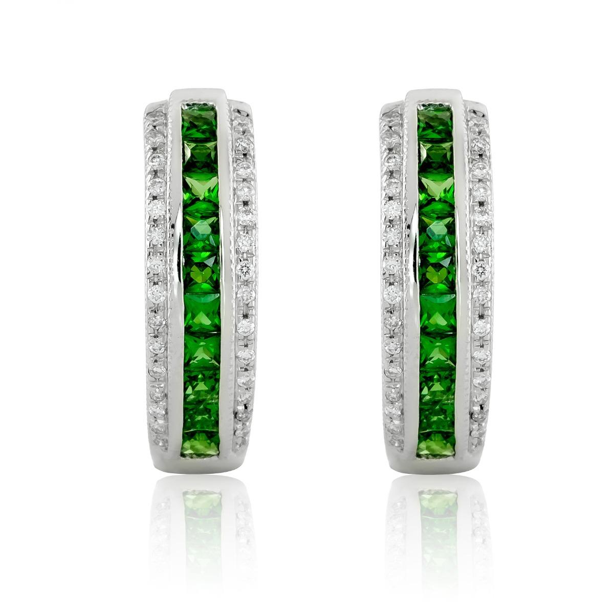 Discover the vibrant elegance of these natural tsavorite earrings, featuring a total weight of 0.54 carats, set in polished 14K white gold. Accented with 0.17 carats of sparkling diamonds, these earrings offer a luxurious and distinctive touch with