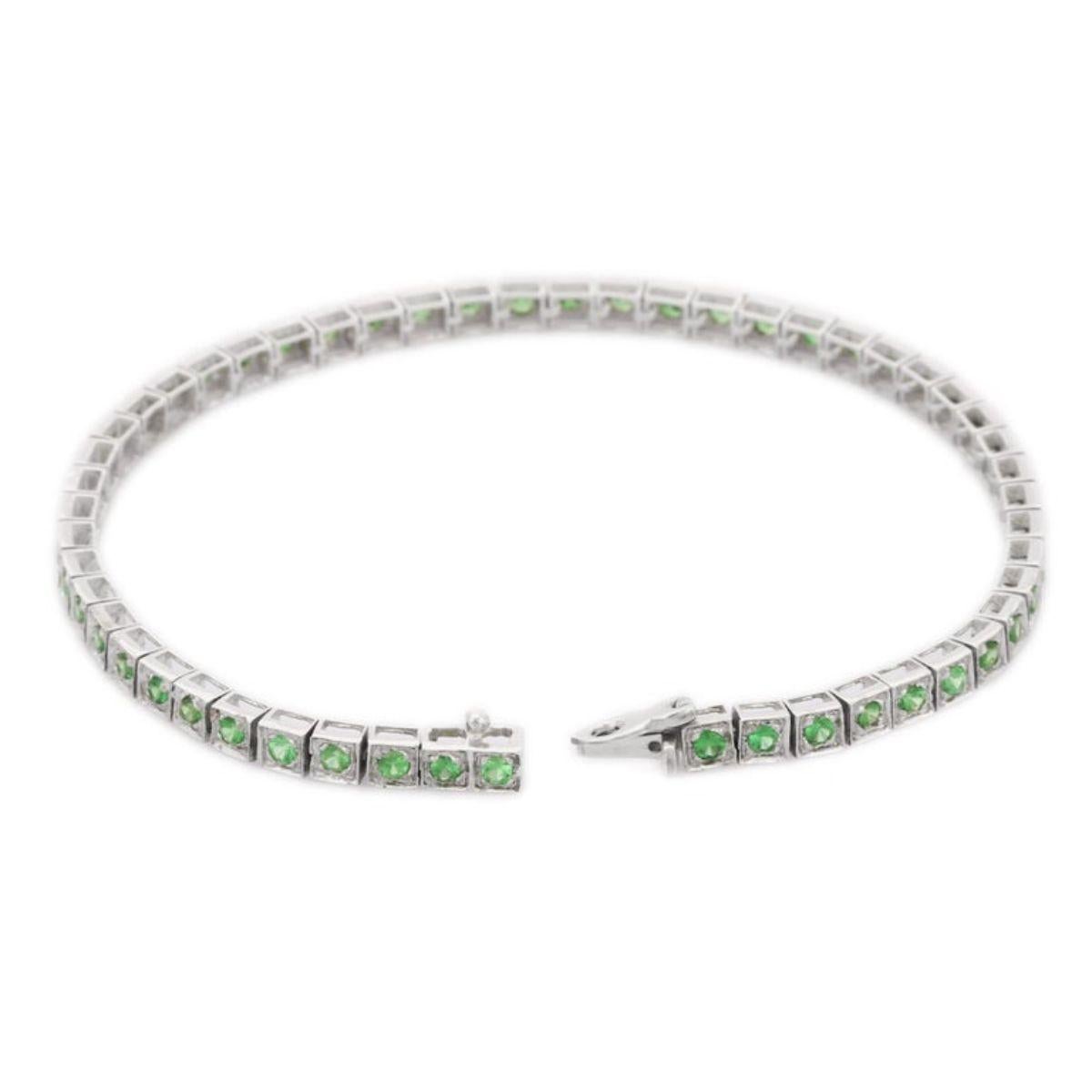 This Tsavorite Tennis Bracelet in 18K gold showcases 52 endlessly sparkling natural tsavorite, weighing 3 carats. It measures 7 inches long in length. 
Tsavorite increase the wearer's strength and confidence.
Designed with perfect round cut