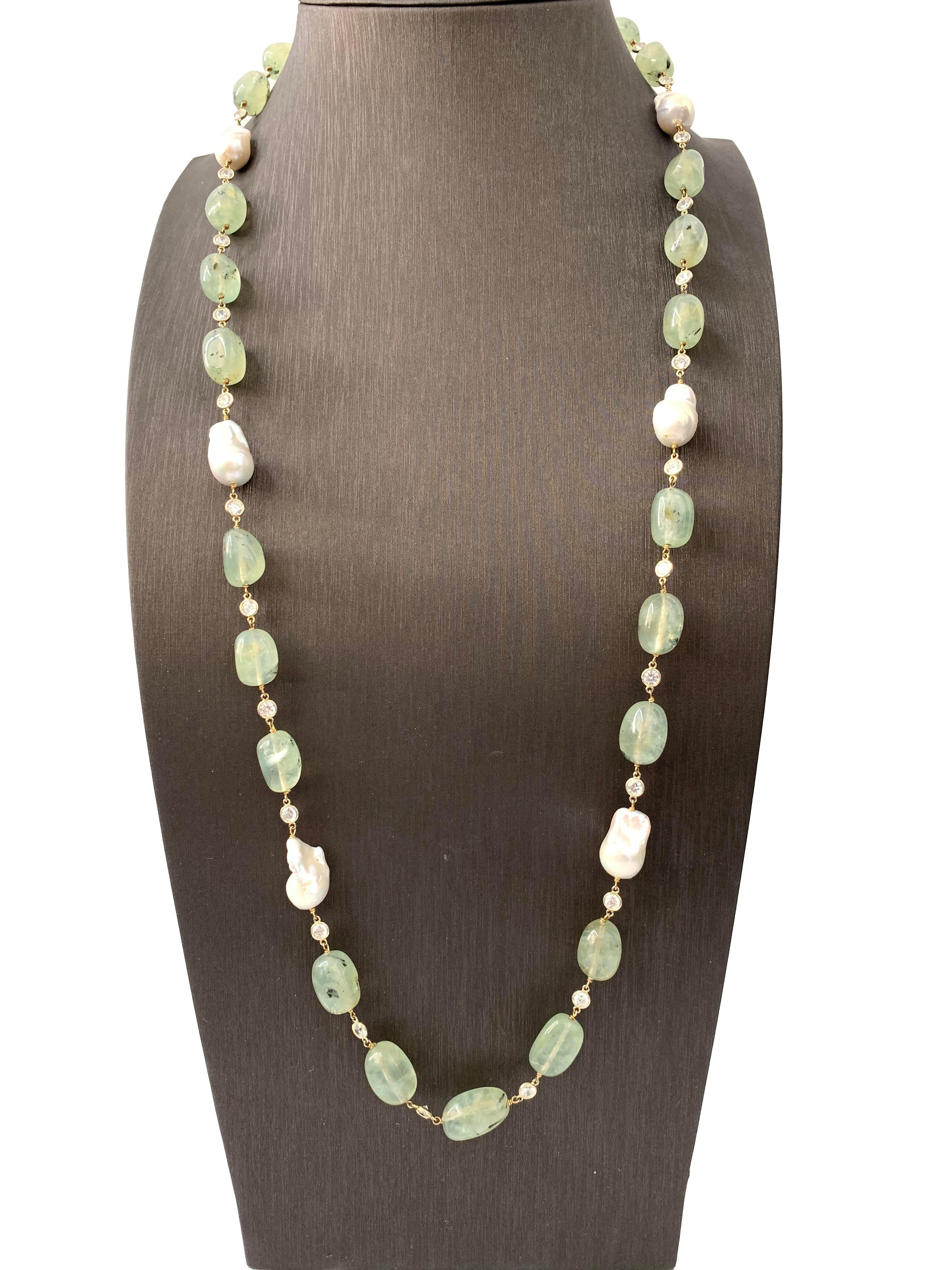 Beautiful tumbled Prehnite and Fresh Water Baroque Pearl Necklace. Each station is hand wire wrapped with 18K Gold plated sterling silver.  Bezel set Cubic Zirconia to space each stone provides beautiful iridescent. Sterling silver clasp. 36