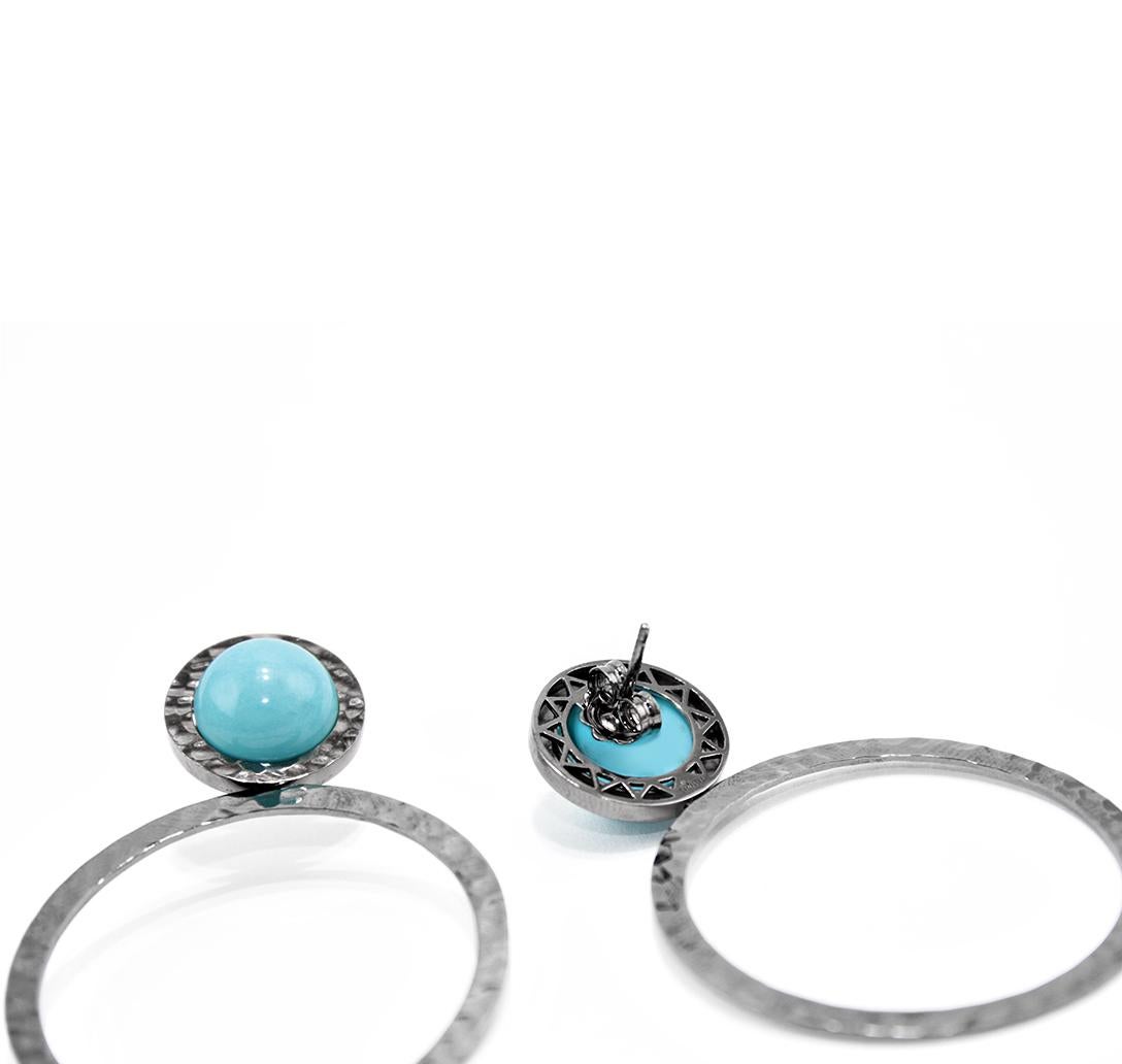 Nice earrings from our collection SOLE.
Earrings realized in 18kt black gold and natural turquoise cabochon. Hammered design on the surfaces. 
Pierce and post system.
Natural Turquoise ct. 10
Black Gold g. 13
Small gold circle diameter cm  1,7 
Big