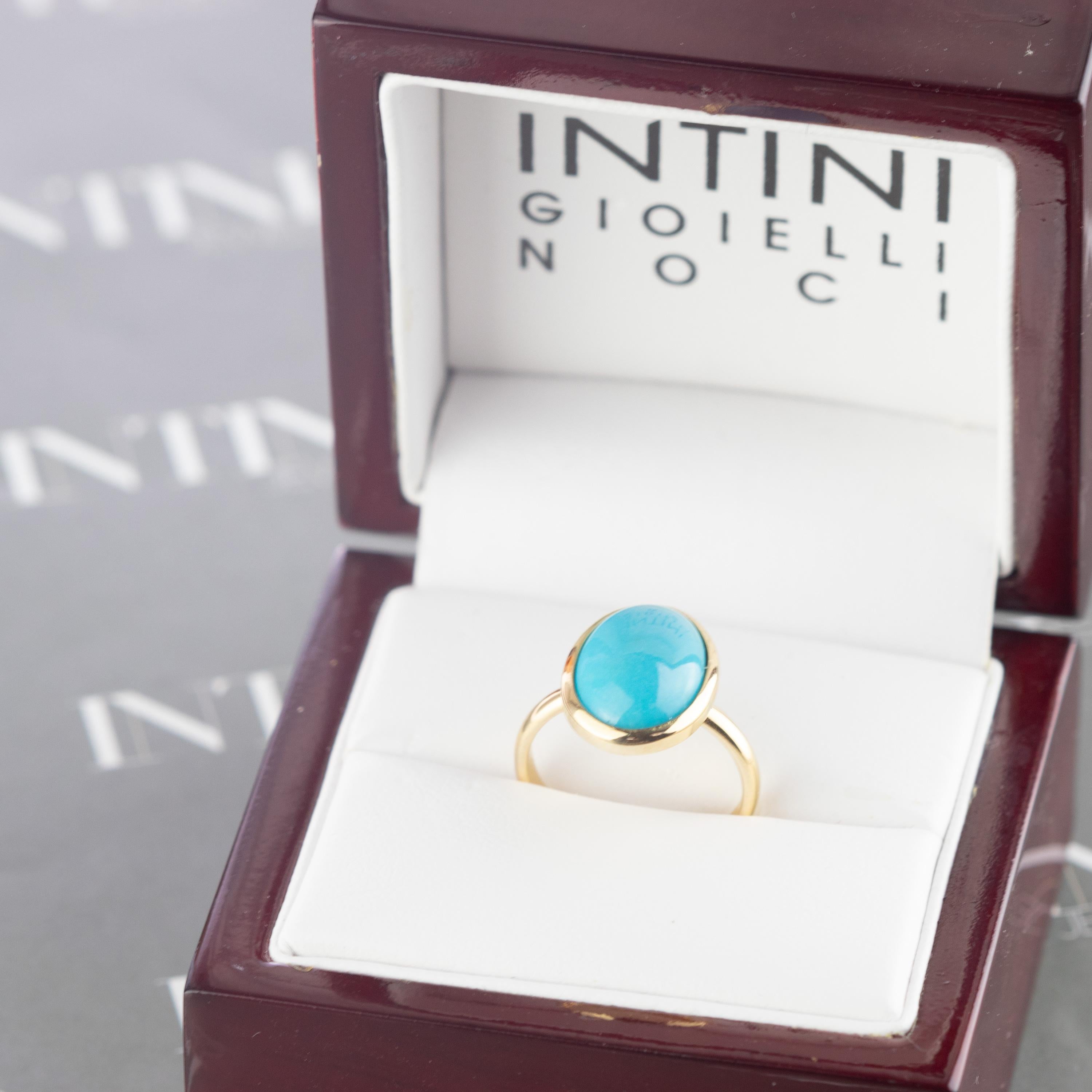 Magnificent ring with an exceptional art work, outstanding display of color and Italian craftsmanship designed by Intini Jewels. This unique ring has a natural oval turquoise over a 18 karat yellow gold cocktail design.
 
This ring represents the