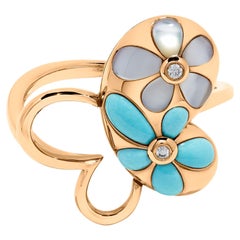 Anello in oro rosa con turchese naturale e diamante bianco da 0,51 carati TW