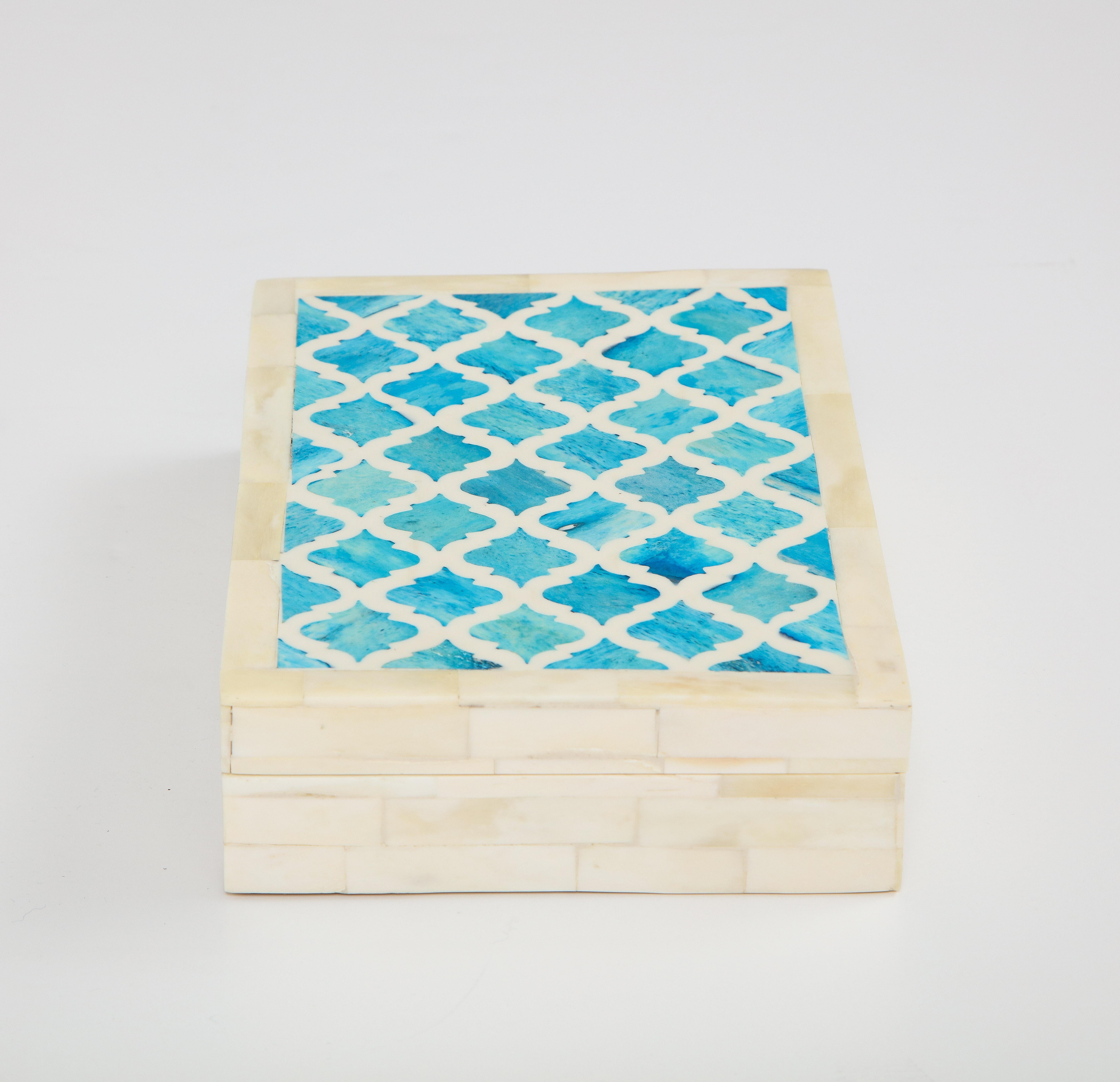 Decorative keepsake/jewelry box clad in natural and dyed bone tiles. Top is in a Moorish motif of inlaid Turquoise bone elements. Handcrafted.