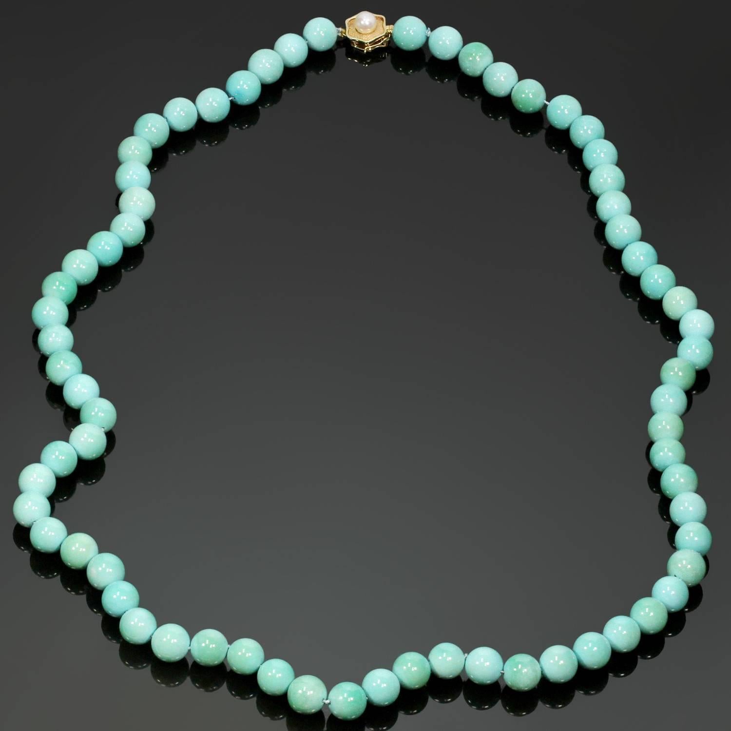 The lovely necklace is composed of 9.80mm - 10.20mm turquoise beads, forming a single strand, completed with a 14k gold clasp and accented with a 6.30mm cultured pearl. The clasp is marked 585 14k. The GIA report # 2185975592, dated January 6, 2018,