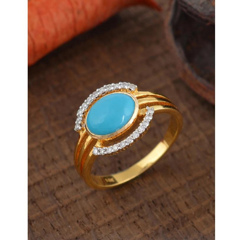 This ring is made with a turquoise gemstone and 14K gold. The ring also has diamonds on it that add the extra modern flair. Curate a graceful look by wearing this ring. 

Specifications

Dimensions: Width: 1.2 cm
Gross Weight: 3.800 gms
Gold Weight: