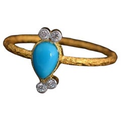 Anello con turchese naturale e diamanti in oro 18 carati