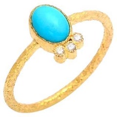 Anello con turchese naturale e diamanti in oro 18 carati