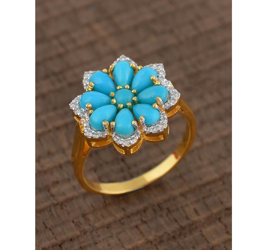 This ring is made of 14K gold and set with a turquoise gemstone. The ring celebrates nature's beauty in a glamorous fashion. It features turquoise gemstones in floral fashion, surrounded by diamonds.

Specifications

Dimensions: Length: 1.6 cm,
