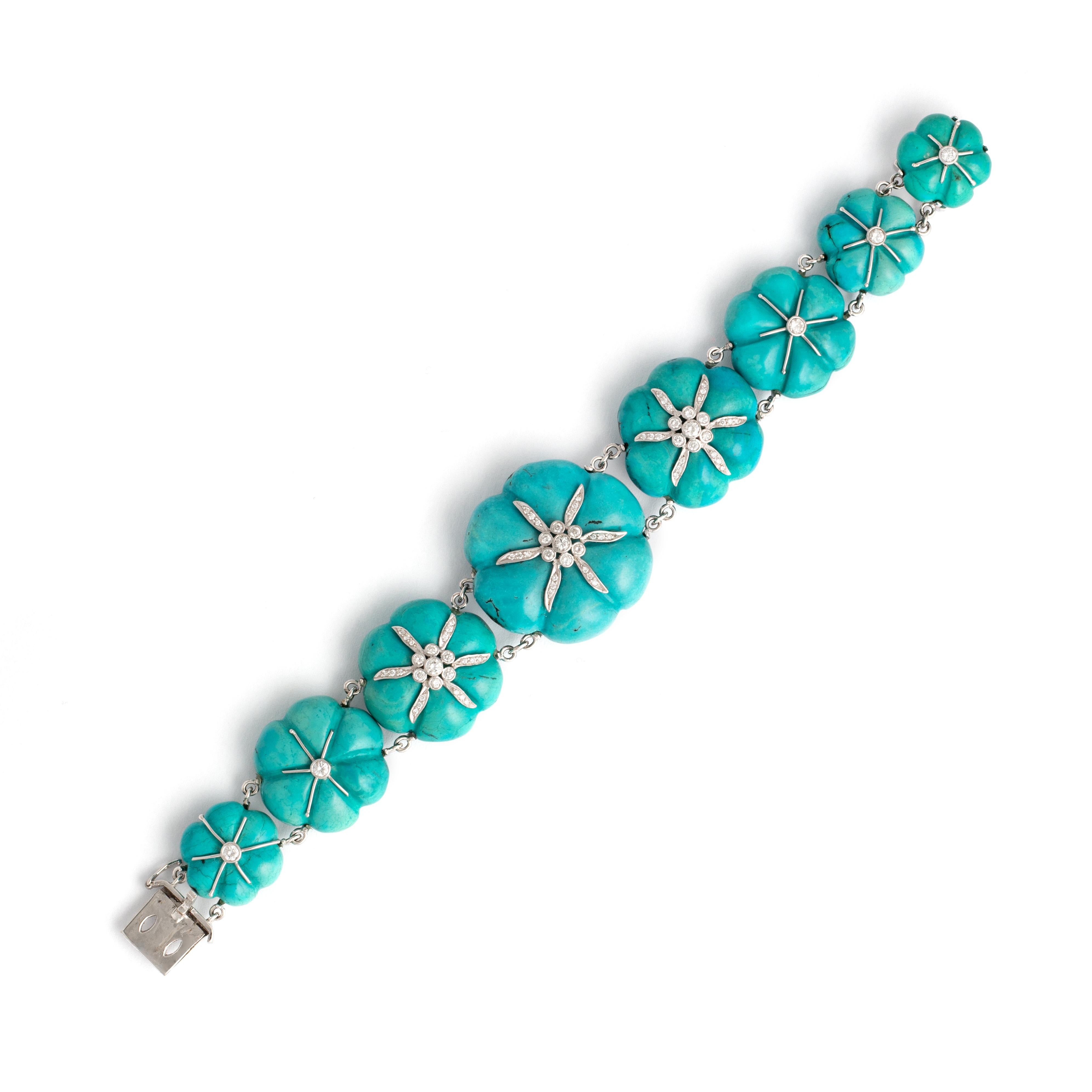 Natural Turquoise diamond and white gold bracelet.

Total length: approx. 18.70 centimeters.
Total height: approx. 1.30 centimeters up to 2.70 centimeters.

Total weight: 70.37 grams.