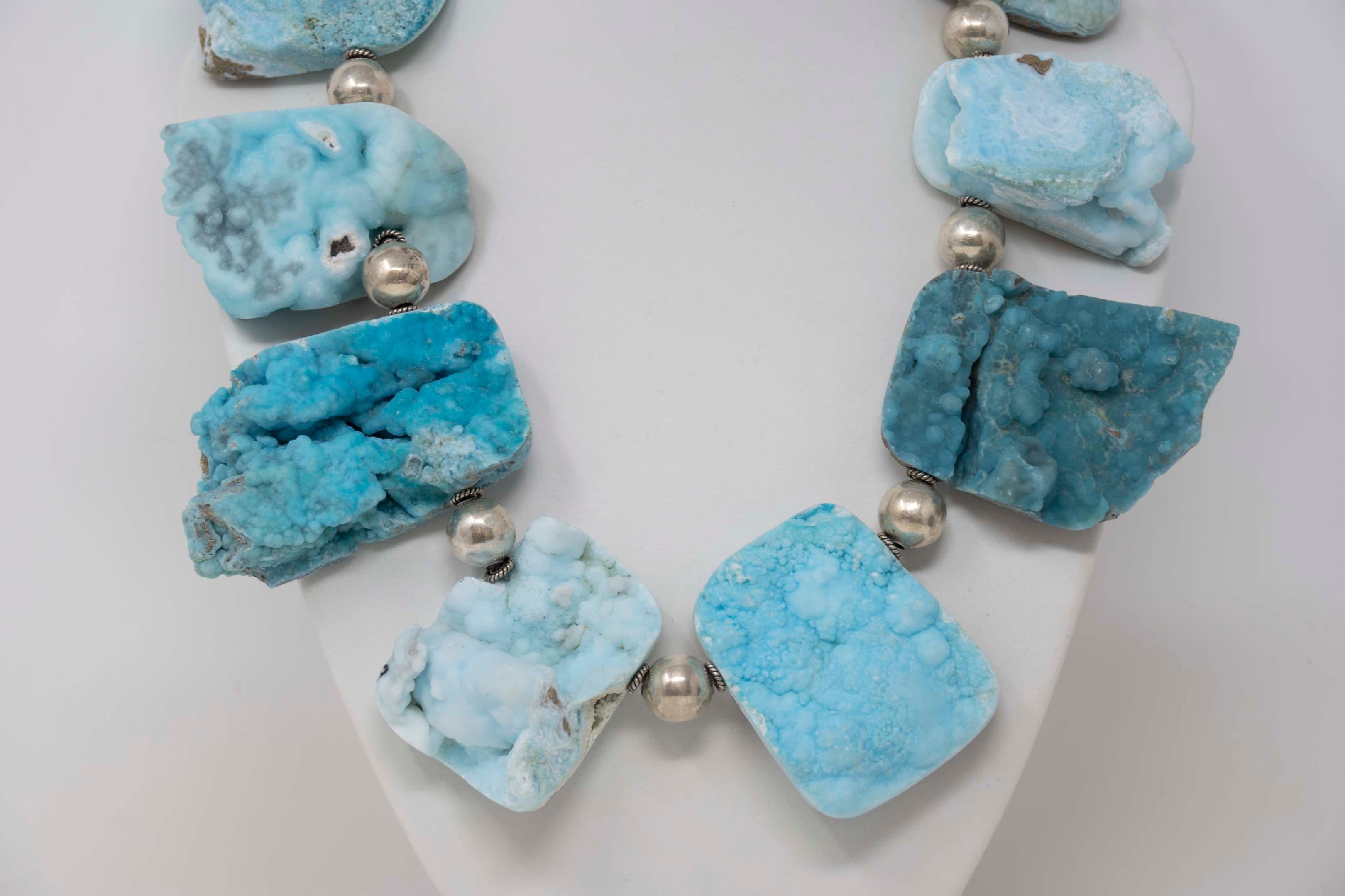 Natural turquoise druzy quartz and sterling silver necklace signed E.M.S. 925 AG “Anna K.” Measures about 18 1/2 inches long.
