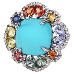 Bague fantaisie en argent avec turquoises naturelles multicolores, saphirs et diamants