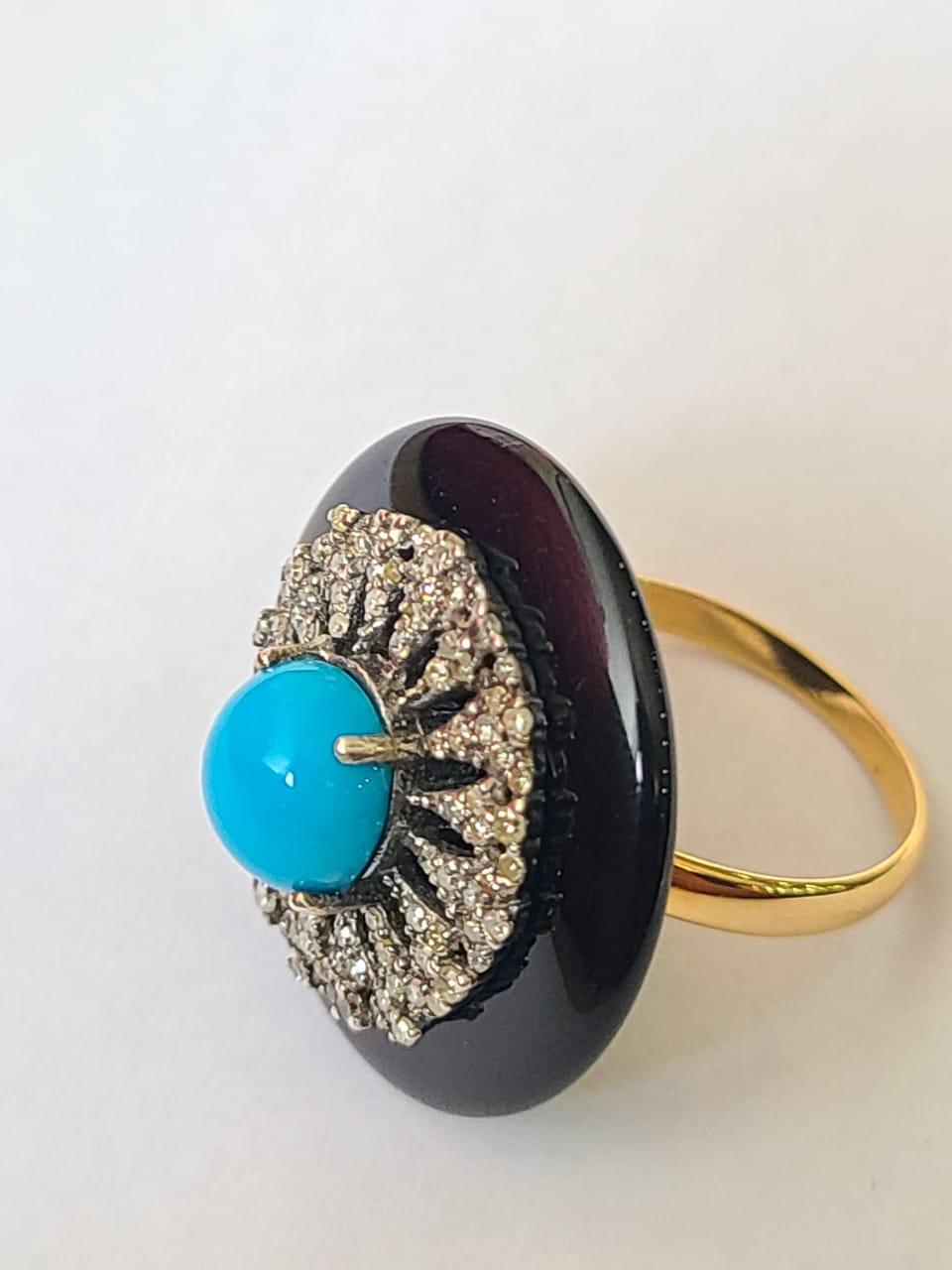 A very beautiful Turquoise, Onyx & Diamonds Art Deco style, Victorian Cocktail/ Dome Ring set in 14K Gold & Silver 925. The weight of the Turquoise is 1.14 carats. The weight of Black Onyx is 17.32 carats. The weight of the Diamonds is 0.54 carats.