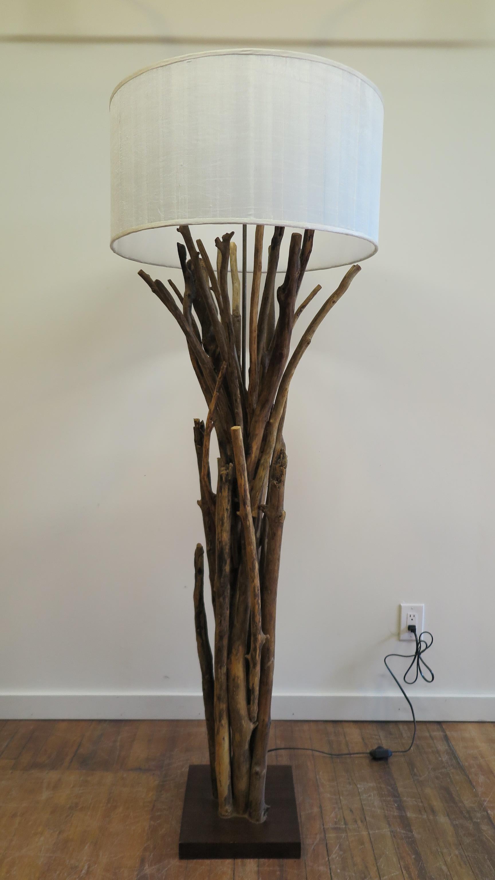 Twig floor lamp, driftwood floor lamp, rustic natural style with linen shade. A tree branch lamp complete with dimmer on and off switch on cord, and also a turn switch on the lamp socket. This allows you to set the dimmer to your liking and maintain