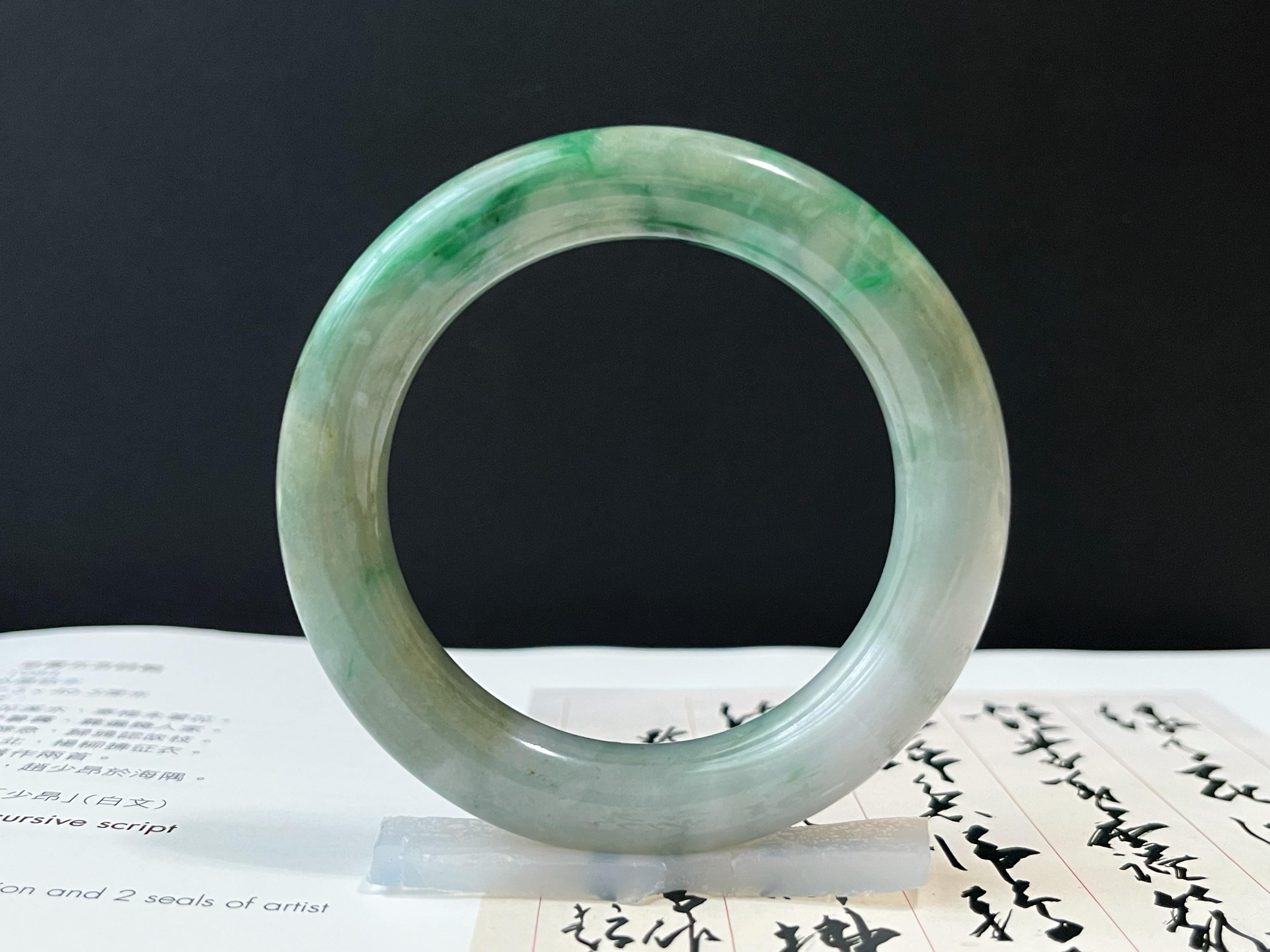 This stunning, premium Myanmar jade bangle is 100% natural, untreated, and undyed Grade-A jadeite. The stunning green floral pattern Mother Nature gifted makes this bracelet unique and attractive. 
 
The jadeite bangle/ bracelet is known as the