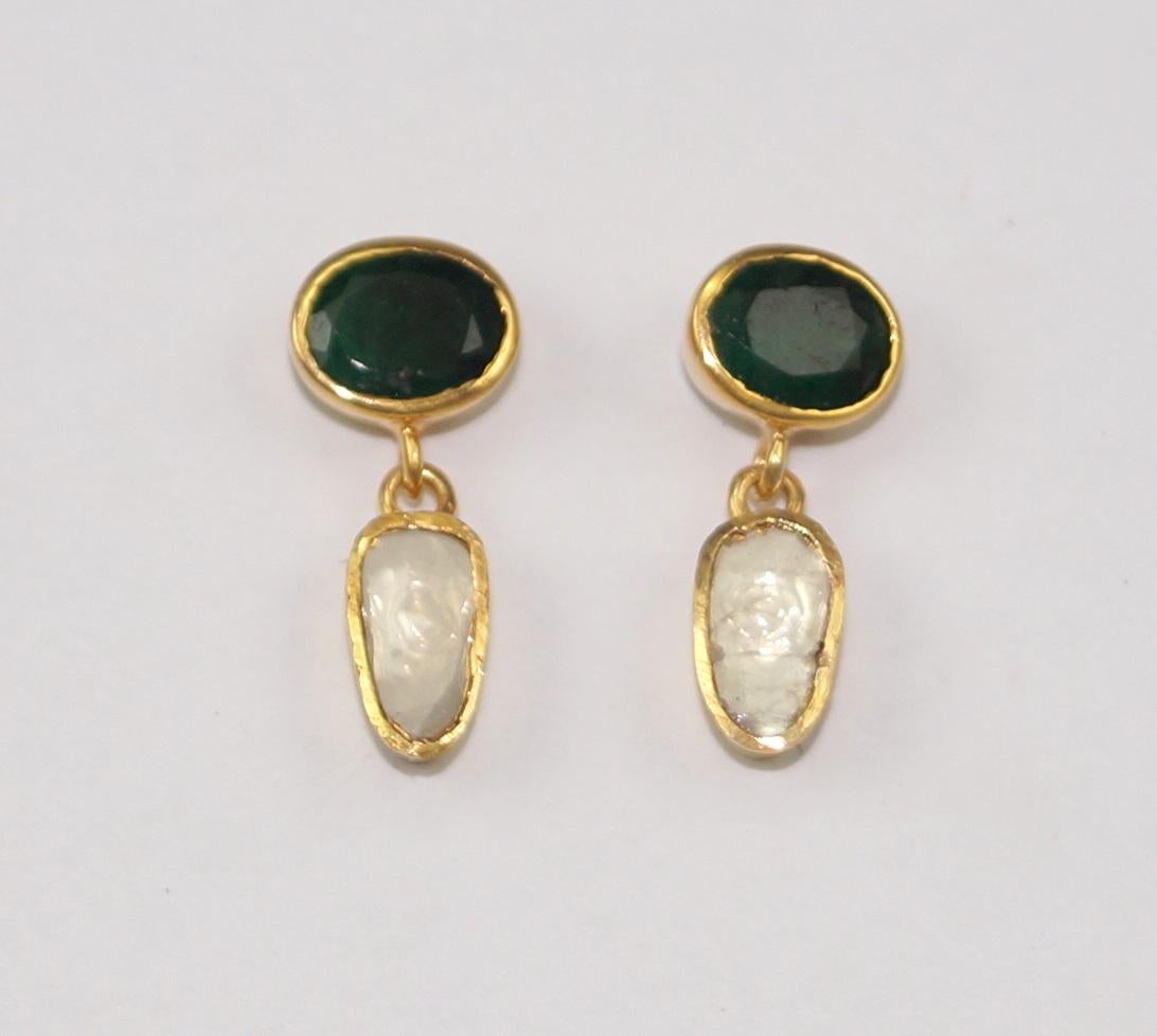 Stunning diamond silver emerald earrings consists of :

Metal- Silver
Metal Purity- sterling silver
Color of metal- Yellow gold plating 
Diamond- Natural uncut diamonds
Diamond origin- Natural earth mined
Diamond weight- 1.65cts
Gemstone- Natural