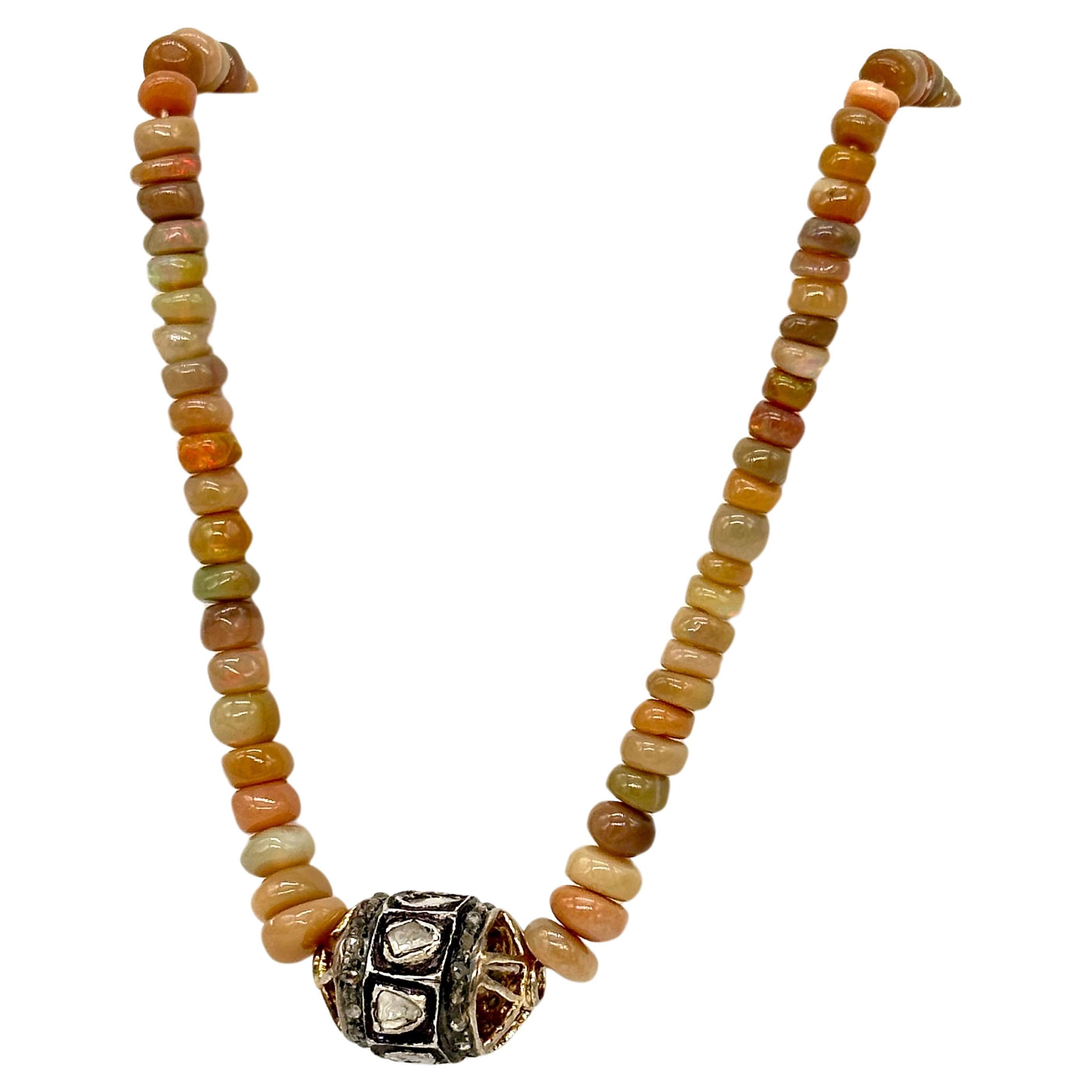 Elevate your style with the enchanting fusion of vibrant opals and dazzling diamonds showcased in our exquisite necklace. Crafted with meticulous attention to detail, this statement piece features graduating orange opal beads, each one radiating