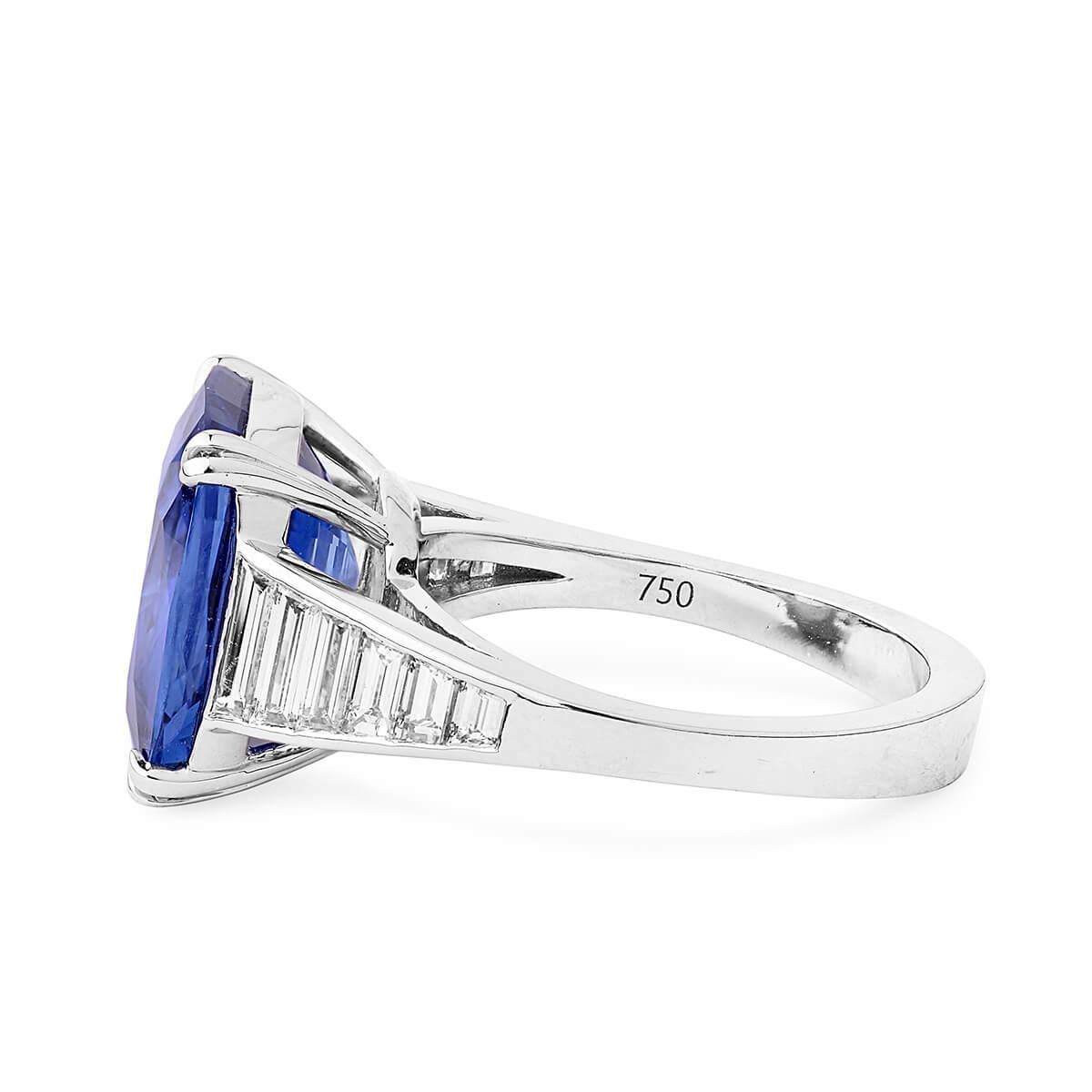 This contemporary piece consists of a natural unheated 0.96 Carat Blue sapphire and is set between smaller natural untreated white diamonds. This piece has been expertly crafted using 18 Karat White Gold. 
This piece can be resized accordingly. 

To