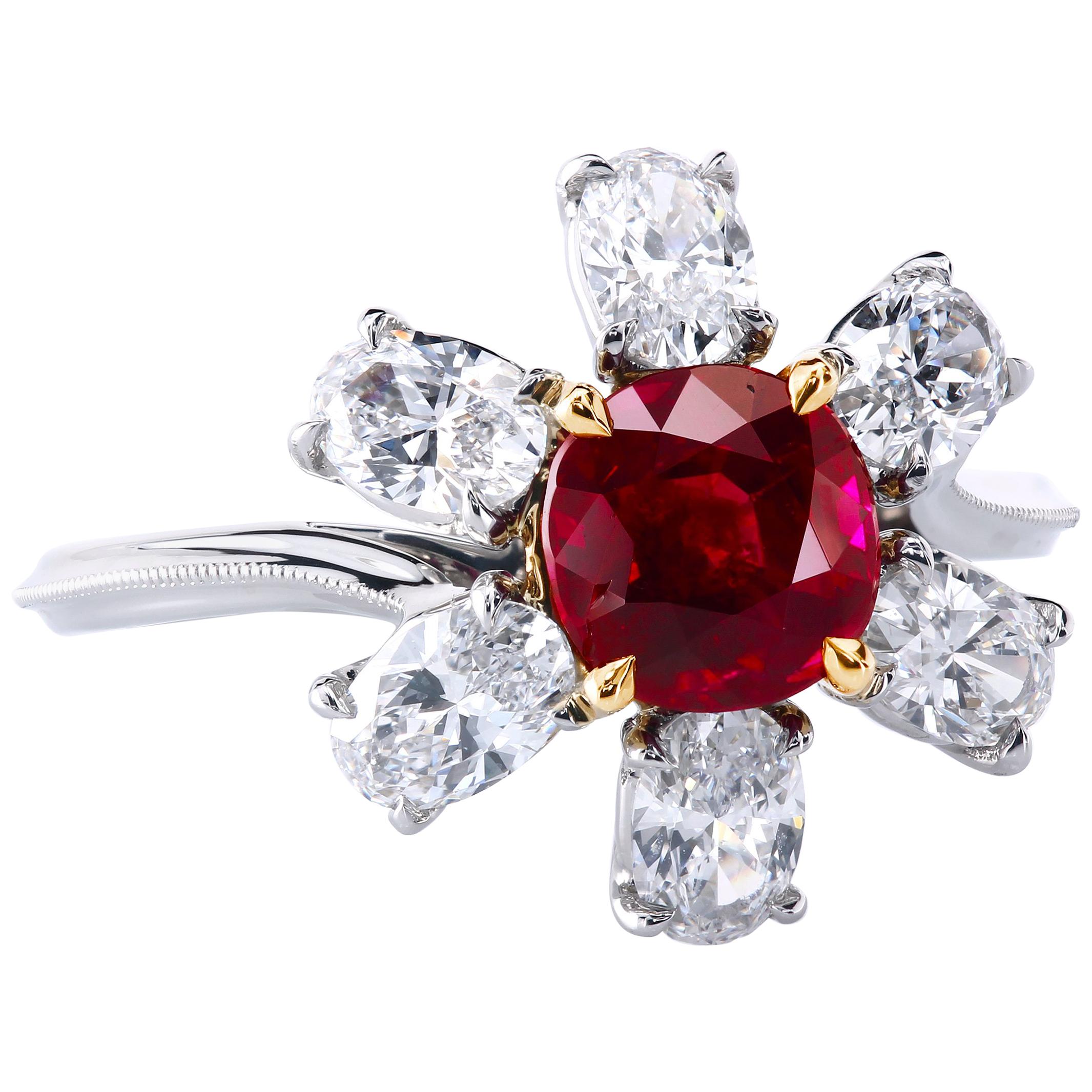 This delicious 1.61-carat eye candy of the certified pigeon-blood Burmese ruby is a gem's world royalty; Gubelin #16115039. 
The ruby is set into a Florette-style setting surrounded by six elongated antique oval diamond petals, EF/VS, total weight