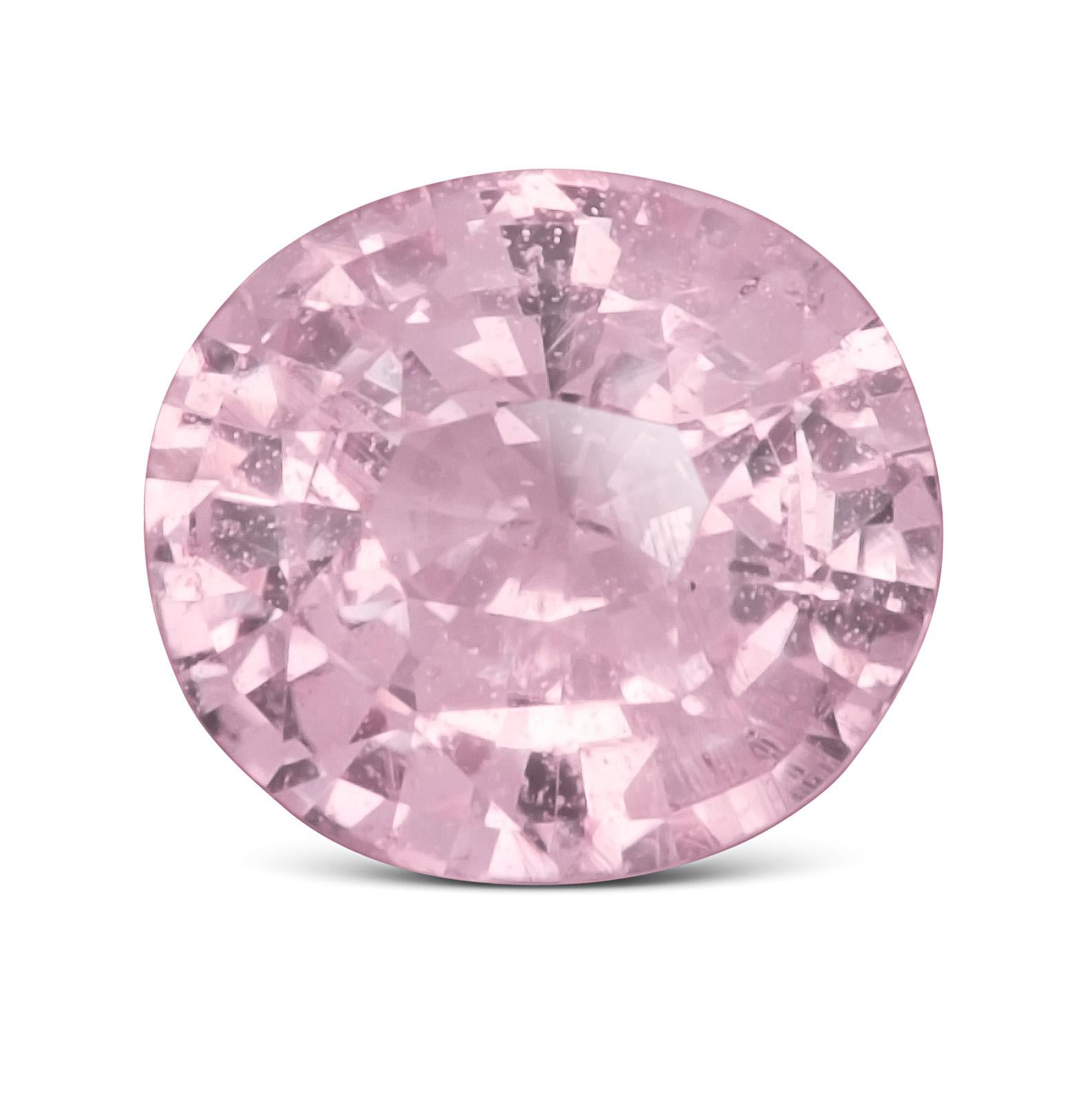This elegant 1.12-carat natural pink sapphire glows with a rare pastel orangy-pink hue, offering a soft yet sophisticated charm. Expertly crafted in an oval shape with a brilliant/step cut, it balances brilliance and depth while maintaining an